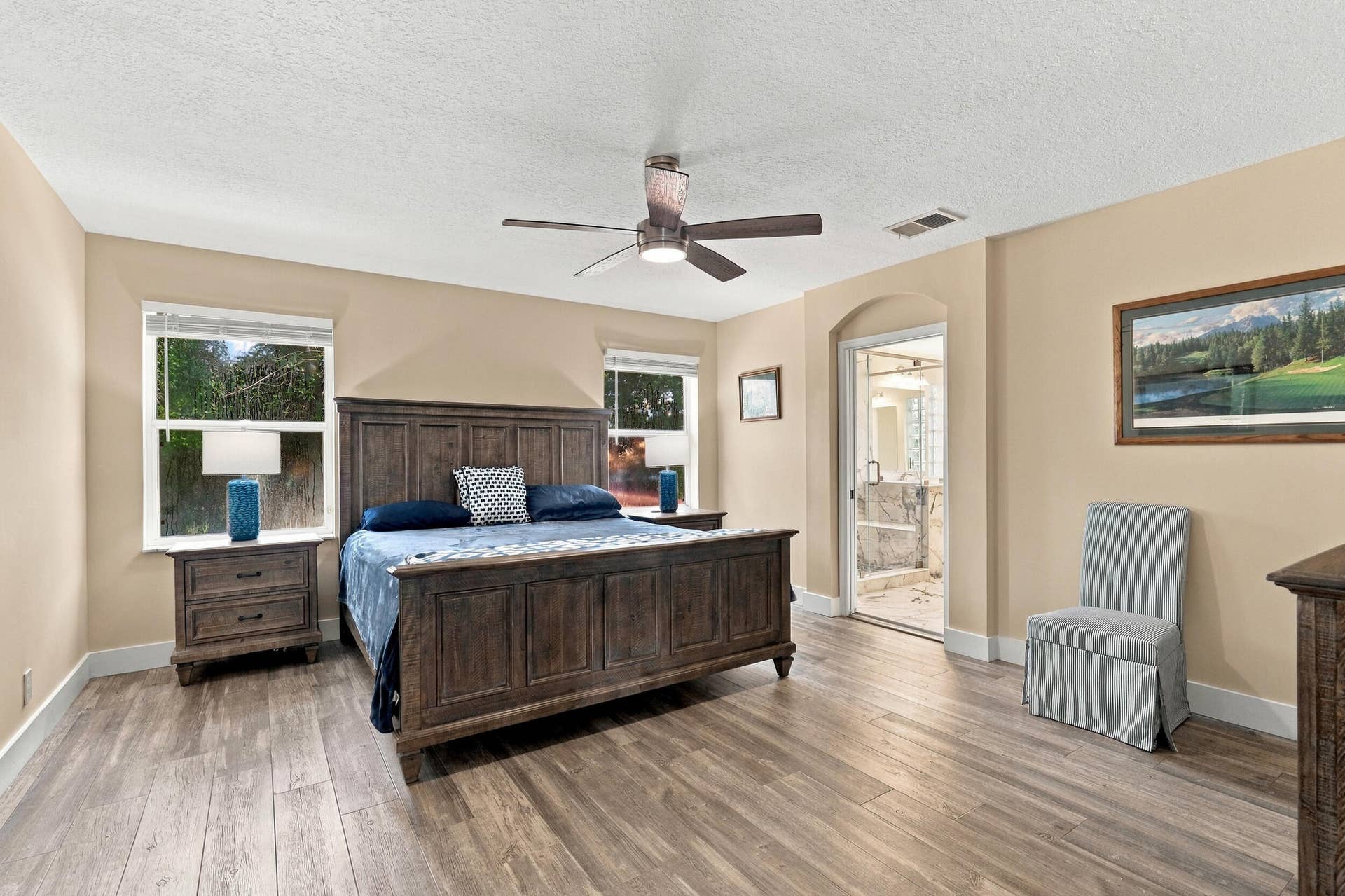 1434 Artimino Lane, Boynton Beach, FL 33436 The primary suite is enormous! It offers lots of natural light, a spa-like ensuite bathroom with a marble shower, frameless glass, as well as a walk-in closet and soaking tub.