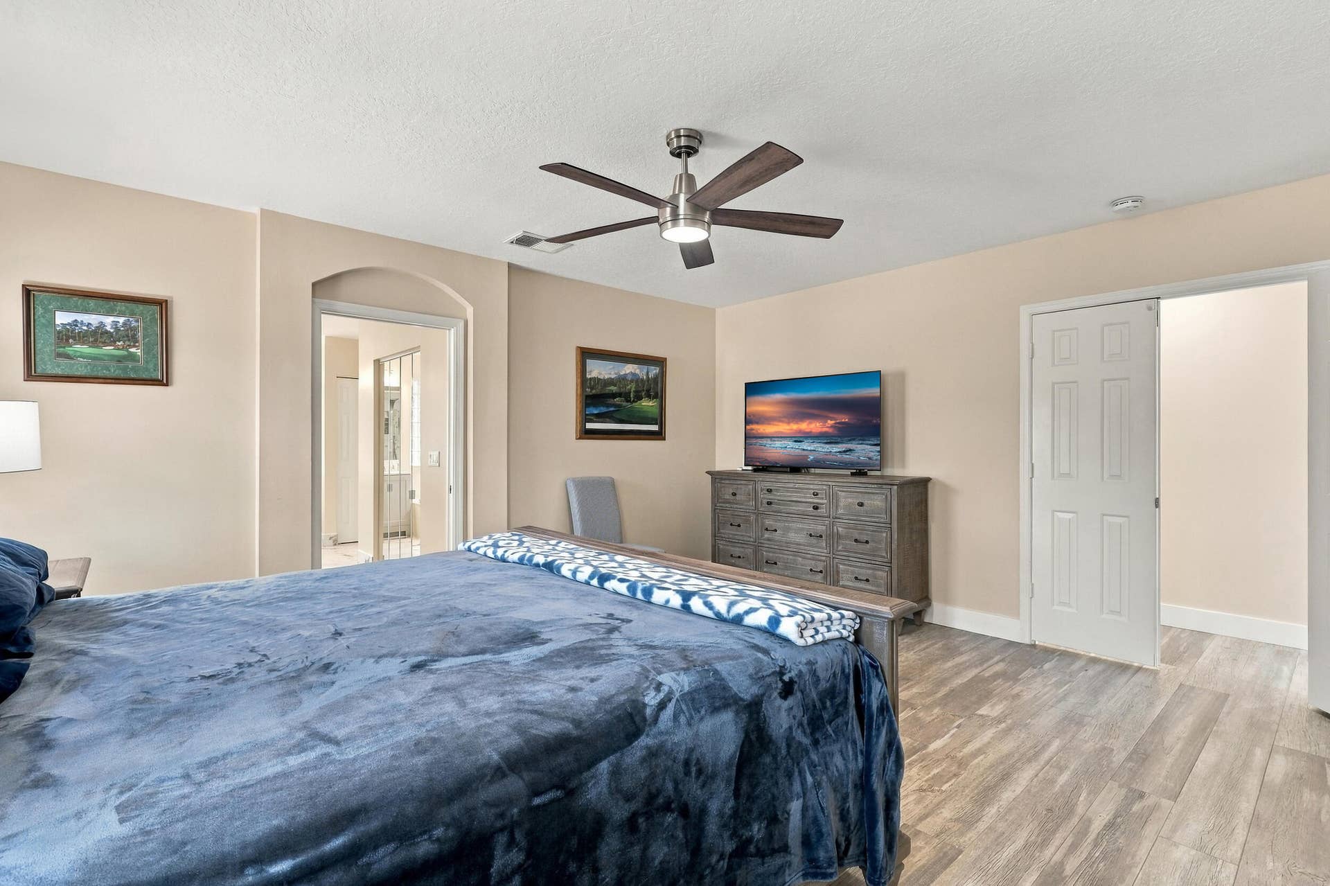 1434 Artimino Lane, Boynton Beach, FL 33436 The primary suite is enormous! It offers lots of natural light, a spa-like ensuite bathroom with a marble shower, frameless glass, as well as a walk-in closet and soaking tub.