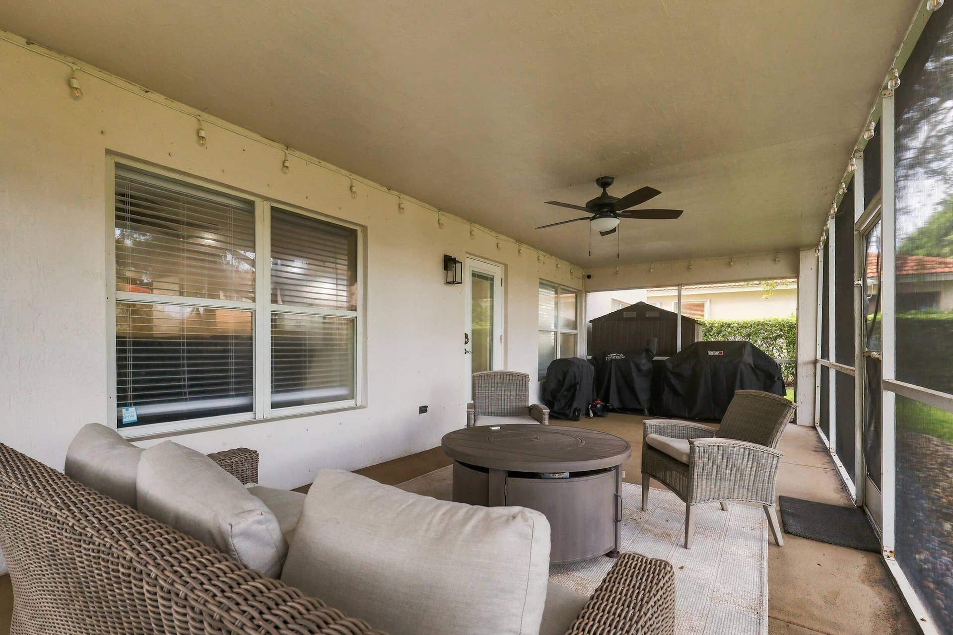 1434 Artimino Lane, Boynton Beach, FL 33436 A 360 square foot covered and screened patio dramatically expands the home's entertaining space, with plenty of room to create both an outdoor living room and dining area for year round enjoyment. Whether hosting family and friends, dining outside, or simply unwinding at the end of the day, the combination of the expansive screened patio, lush hedges, full fencing, and complete rear privacy makes this a truly special outdoor setting.
