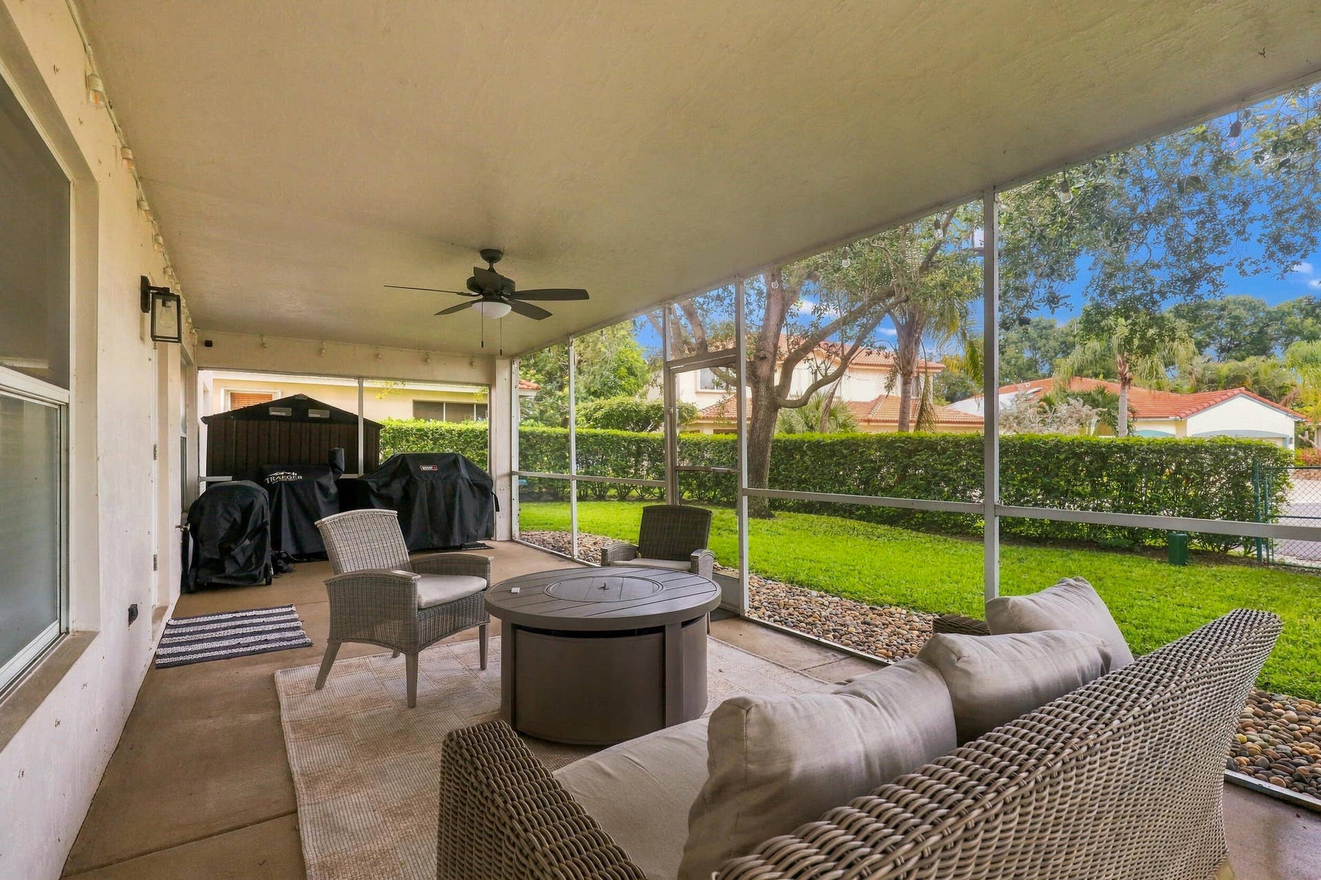 1434 Artimino Lane, Boynton Beach, FL 33436 A 360 square foot covered and screened patio dramatically expands the home's entertaining space, with plenty of room to create both an outdoor living room and dining area for year round enjoyment. Whether hosting family and friends, dining outside, or simply unwinding at the end of the day, the combination of the expansive screened patio, lush hedges, full fencing, and complete rear privacy makes this a truly special outdoor setting.