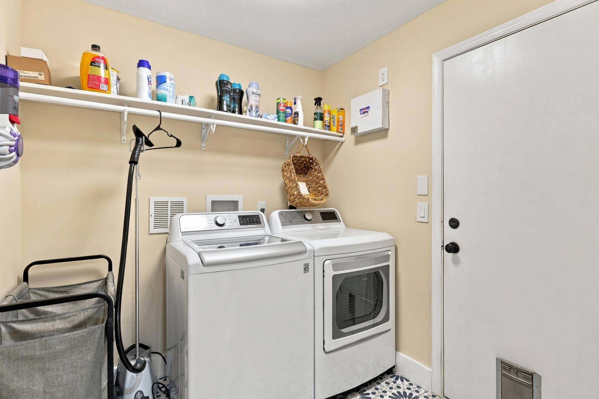 1434 Artimino Lane, Boynton Beach, FL 33436 A first-floor laundry room and mudroom attach to the pedestrian door to the garage.