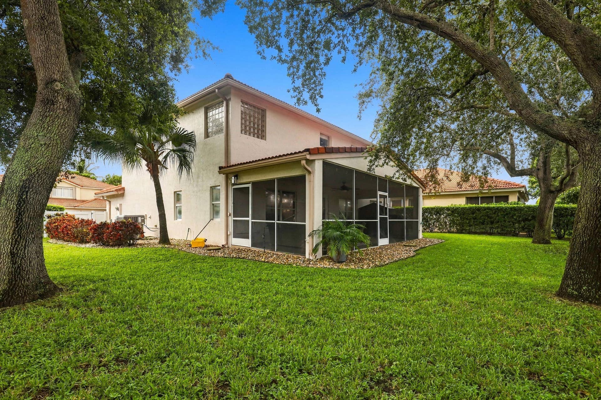 1434 Artimino Lane, Boynton Beach, FL 33436 A 360 square foot covered and screened patio dramatically expands the home's entertaining space, with plenty of room to create both an outdoor living room and dining area for year round enjoyment. Whether hosting family and friends, dining outside, or simply unwinding at the end of the day, the combination of the expansive screened patio, lush hedges, full fencing, and complete rear privacy makes this a truly special outdoor setting.