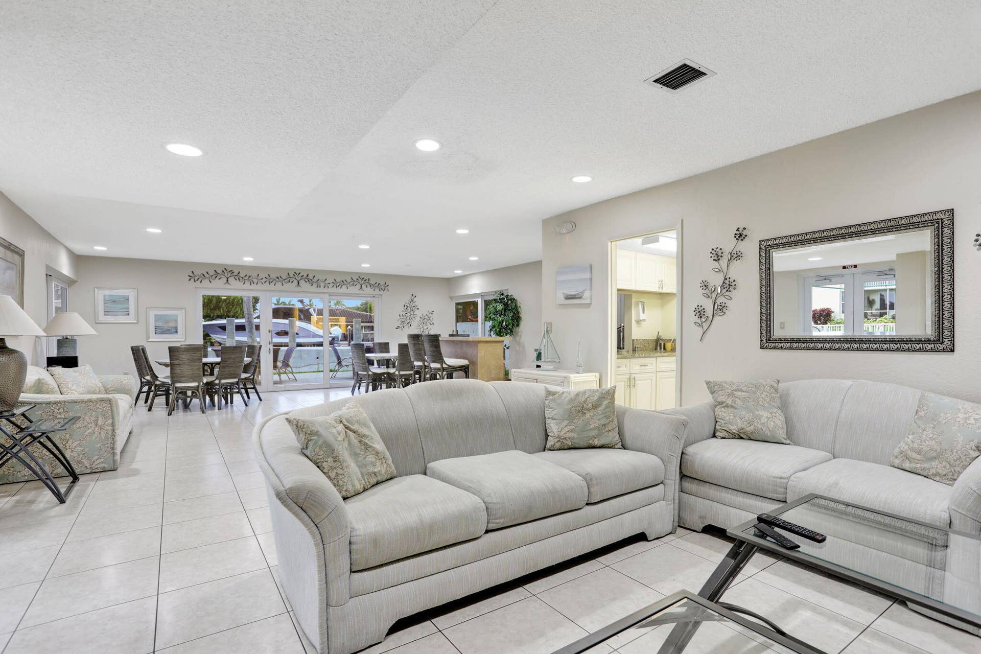 Rec center off pool with indoor/outdoor seating, kitchen, grill, bathrooms