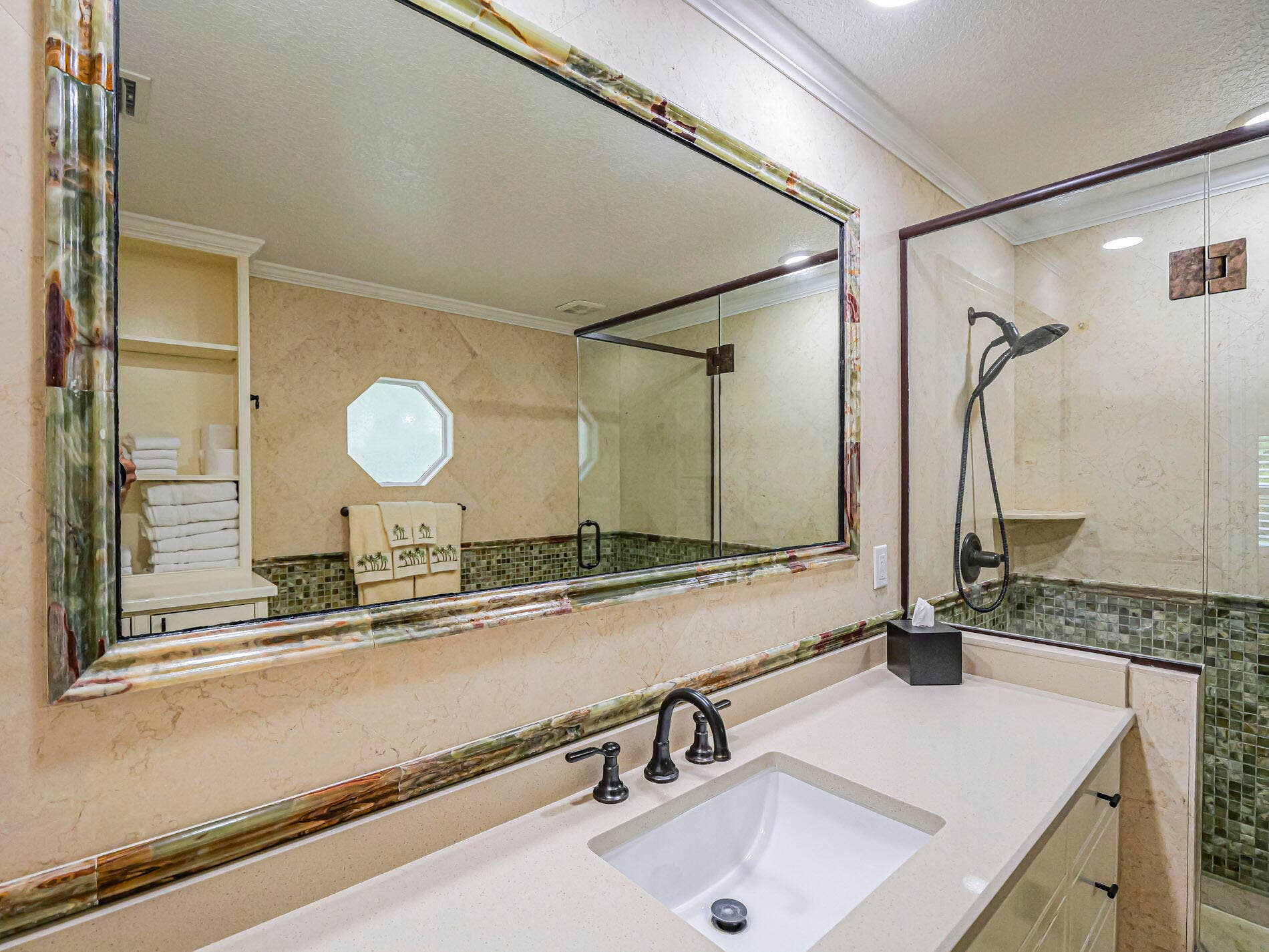 215 8TH Terrace, Vero Beach, FL 32962 Bathroom with attractive tile and glass