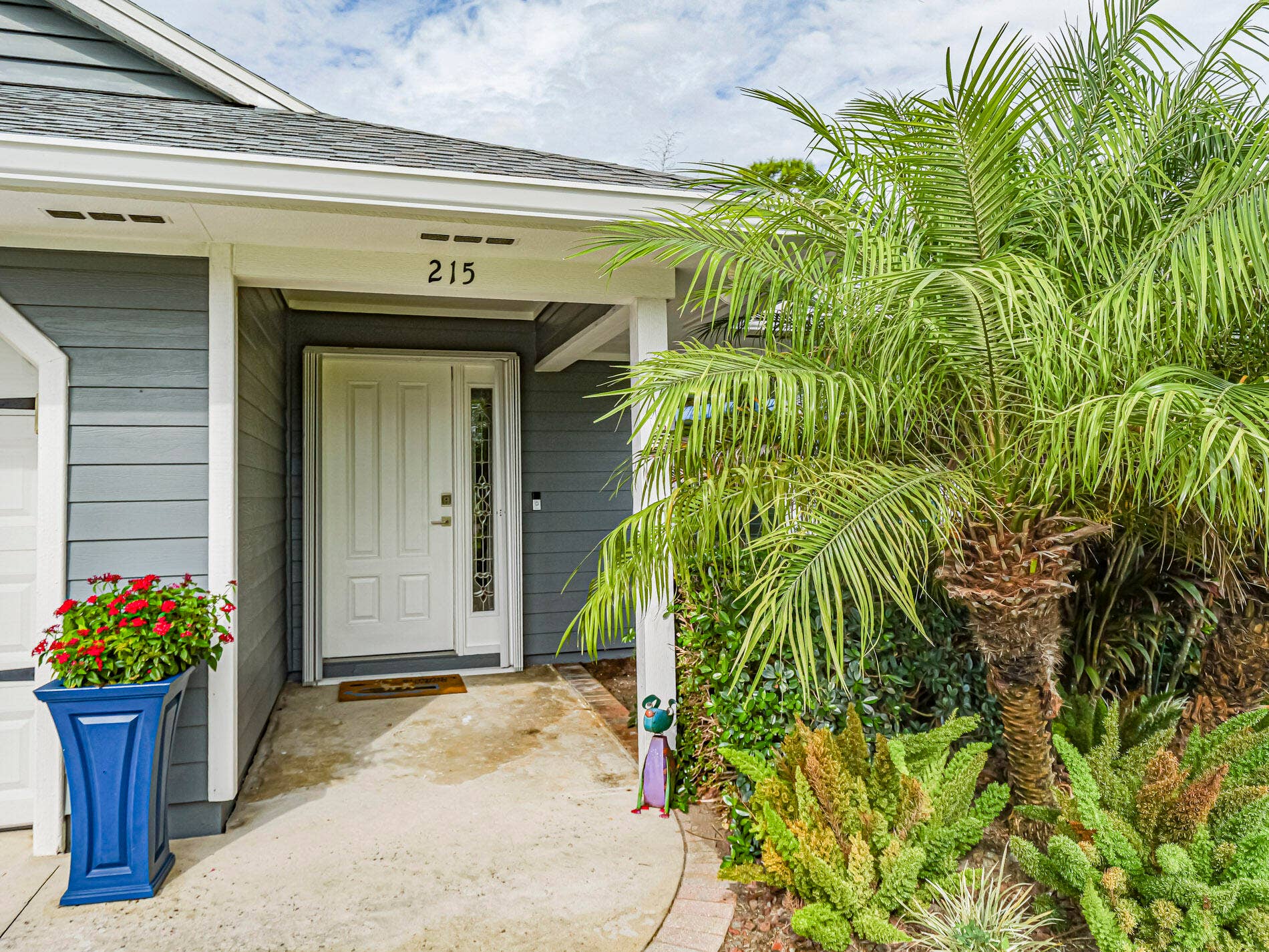 215 8TH Terrace, Vero Beach, FL 32962 Covered entry, attractive landscaping.