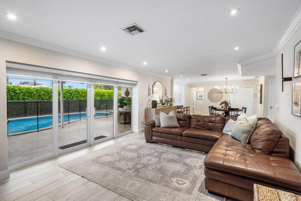 979 SW 13TH Drive, Boca Raton, FL 33486 Sliding glass doors overlook the pool.