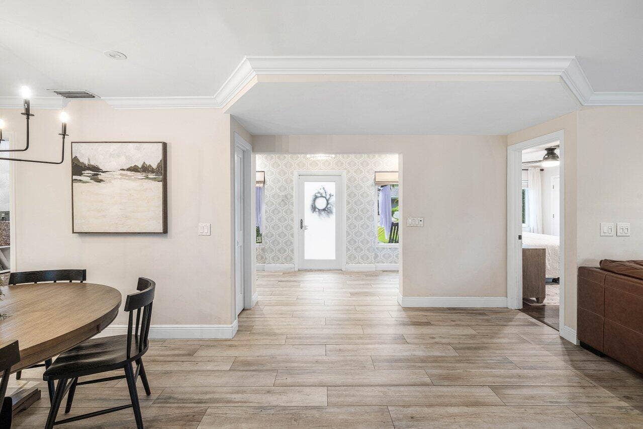 979 SW 13TH Drive, Boca Raton, FL 33486 Wide sightlines and continuous flooring connect the main living areas to the entry.