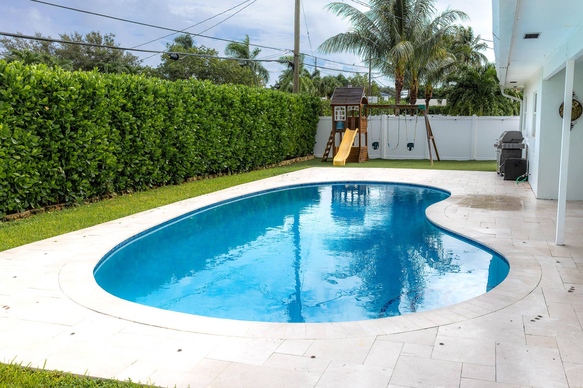 979 SW 13TH Drive, Boca Raton, FL 33486 Pool surrounded by a spacious deck.