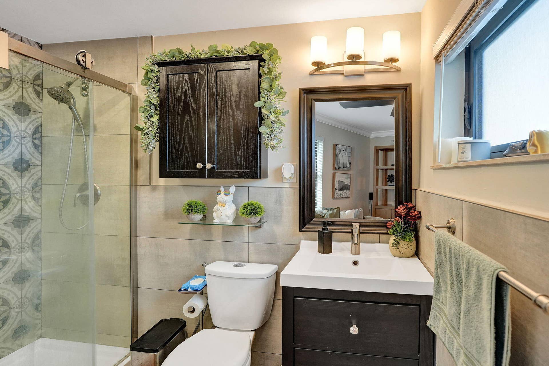 Bathroom with standing shower and frosted window for plenty of natural light