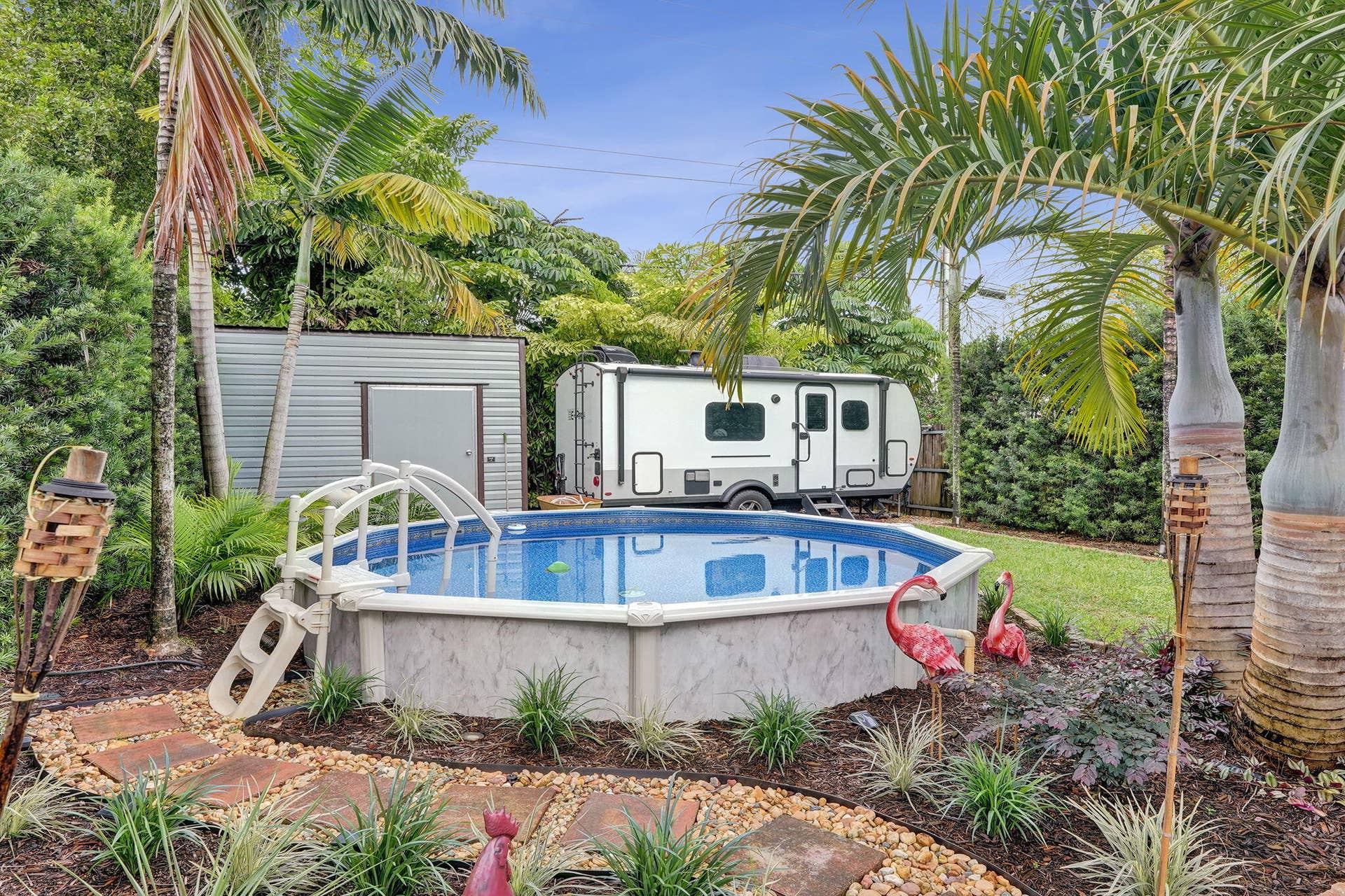 Backyard with saltwater pool and storage shed
