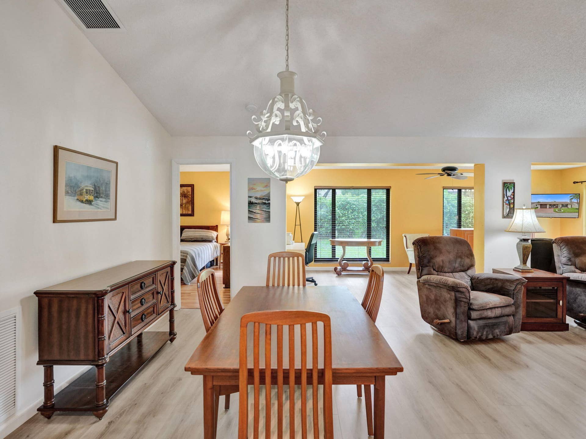 2085 SW 15th Place, Deerfield Beach, FL 33442 Vaulted ceiling with an ornate chandelier, wood-finish flooring, and recessed lighting