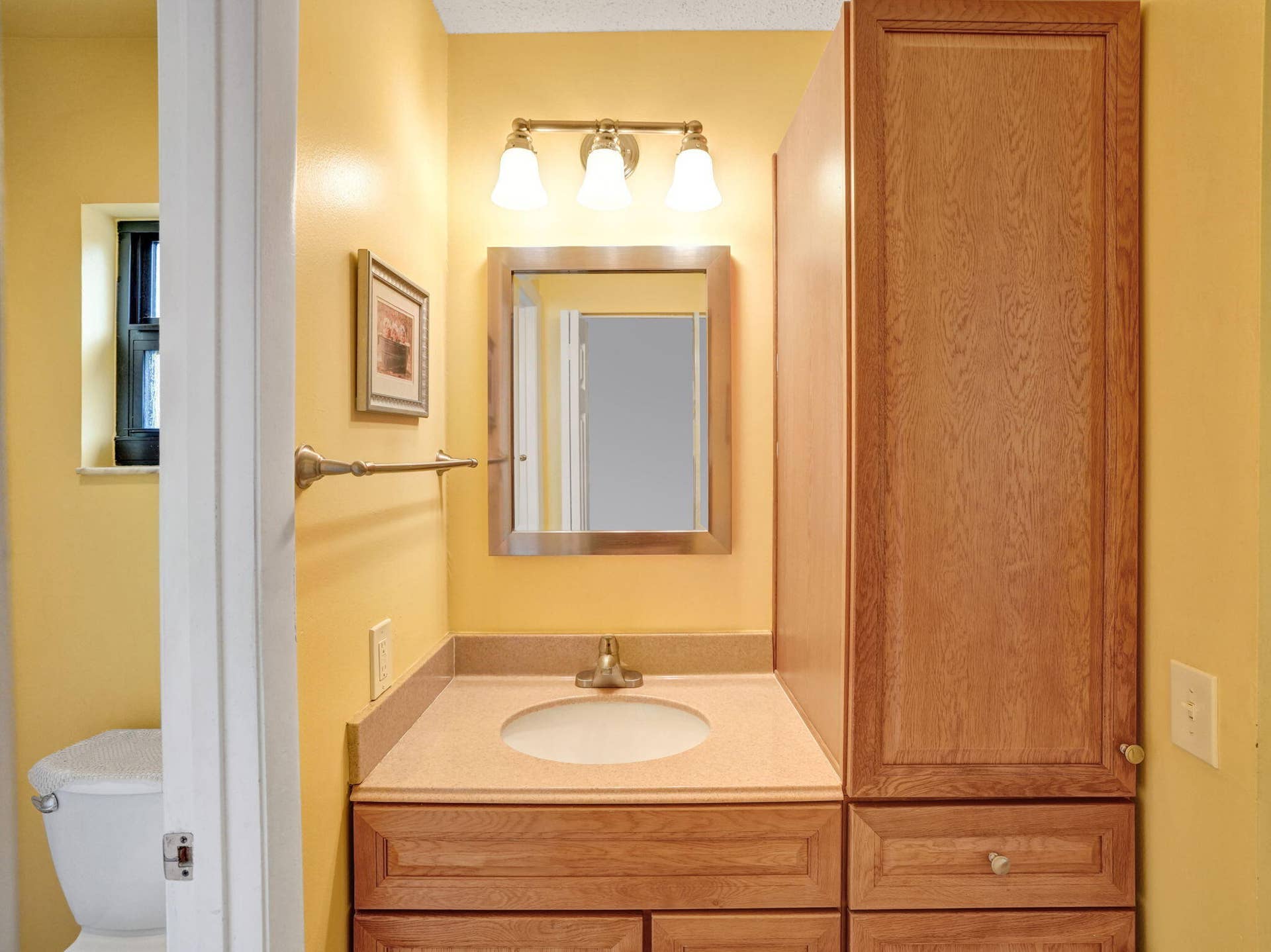 2085 SW 15th Place, Deerfield Beach, FL 33442 The primary bathrooms separate vanity area allows use of the sink while the toilet and shower room remain private.