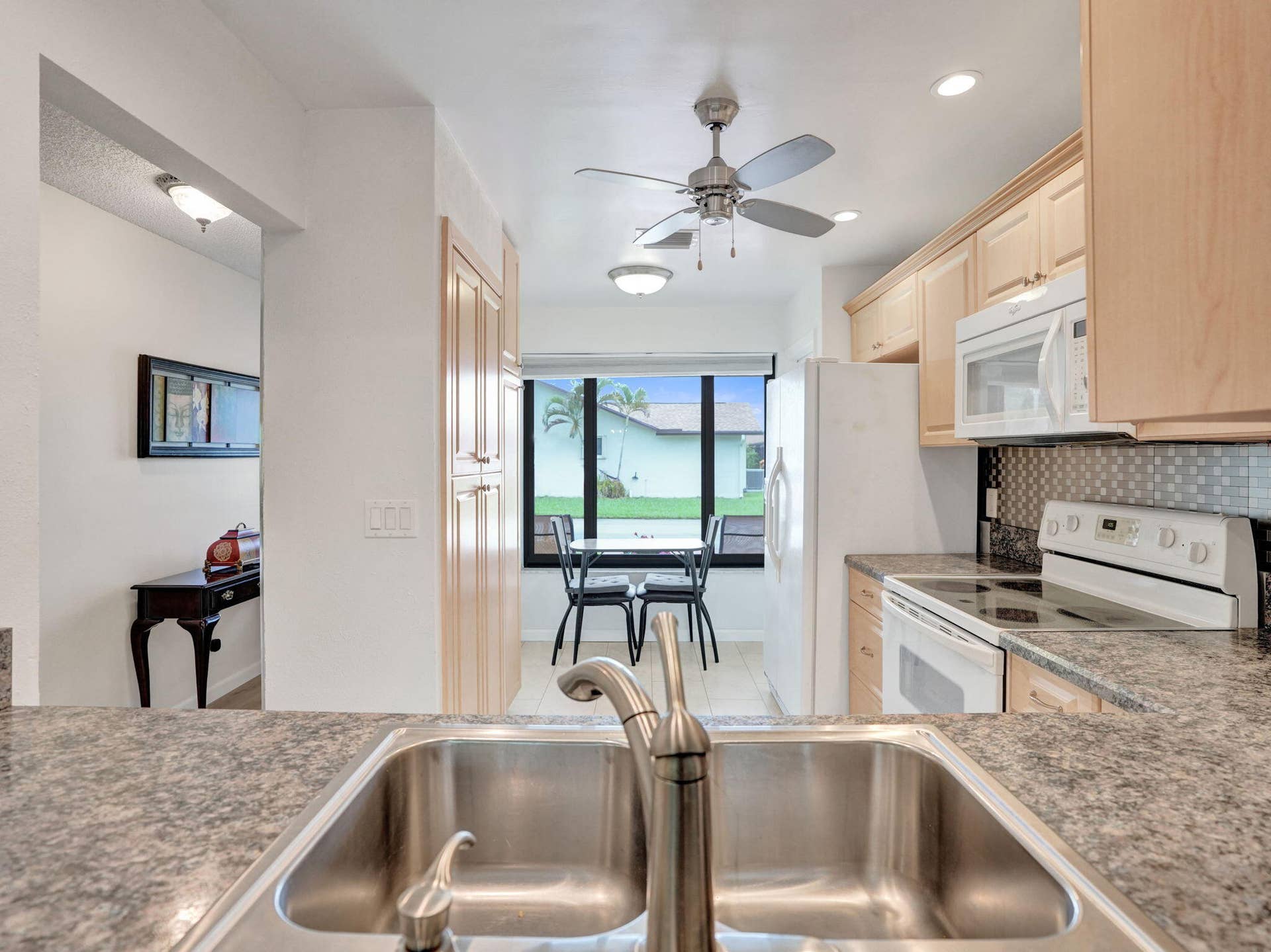 2085 SW 15th Place, Deerfield Beach, FL 33442 Stainless steel double basin sink with a single-handle faucet