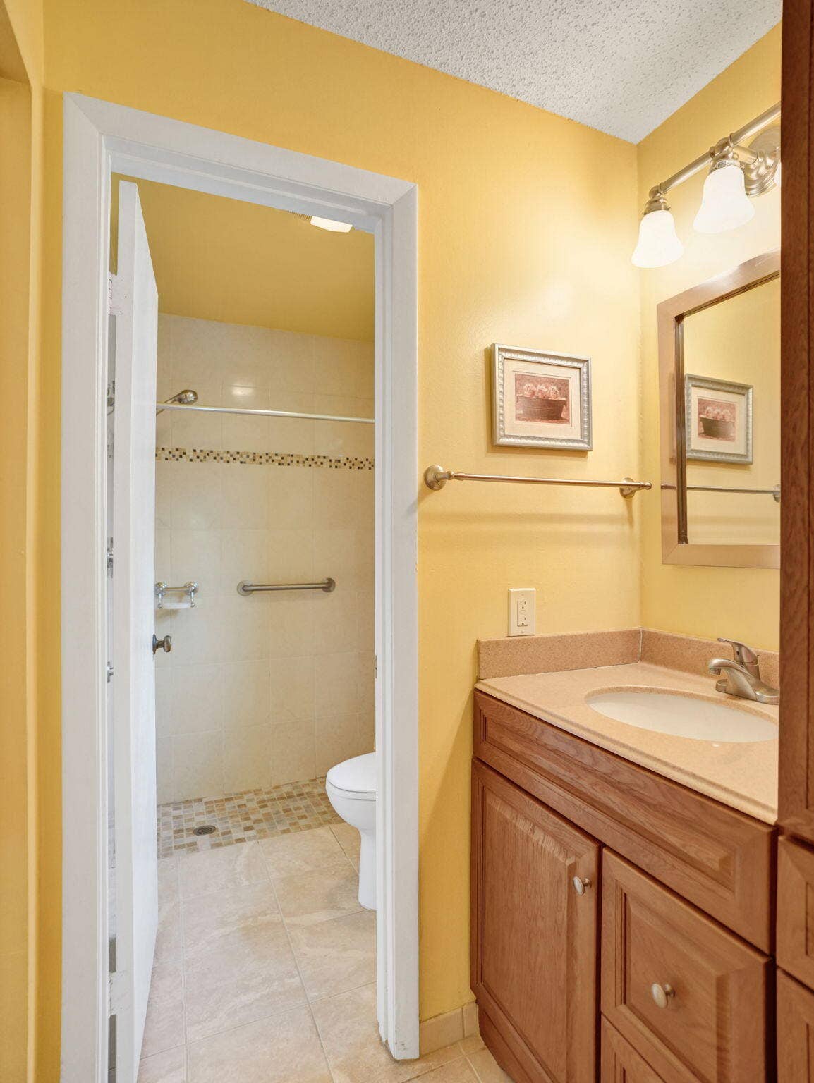 2085 SW 15th Place, Deerfield Beach, FL 33442 Updated primary bathroom with a separate vanity area outside the private toilet and shower room.