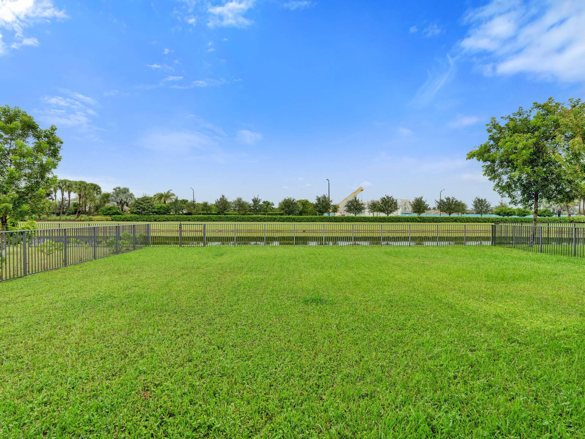 4655 CITRON Way, Westlake, FL 33470 Expansive grassy yard with fencing