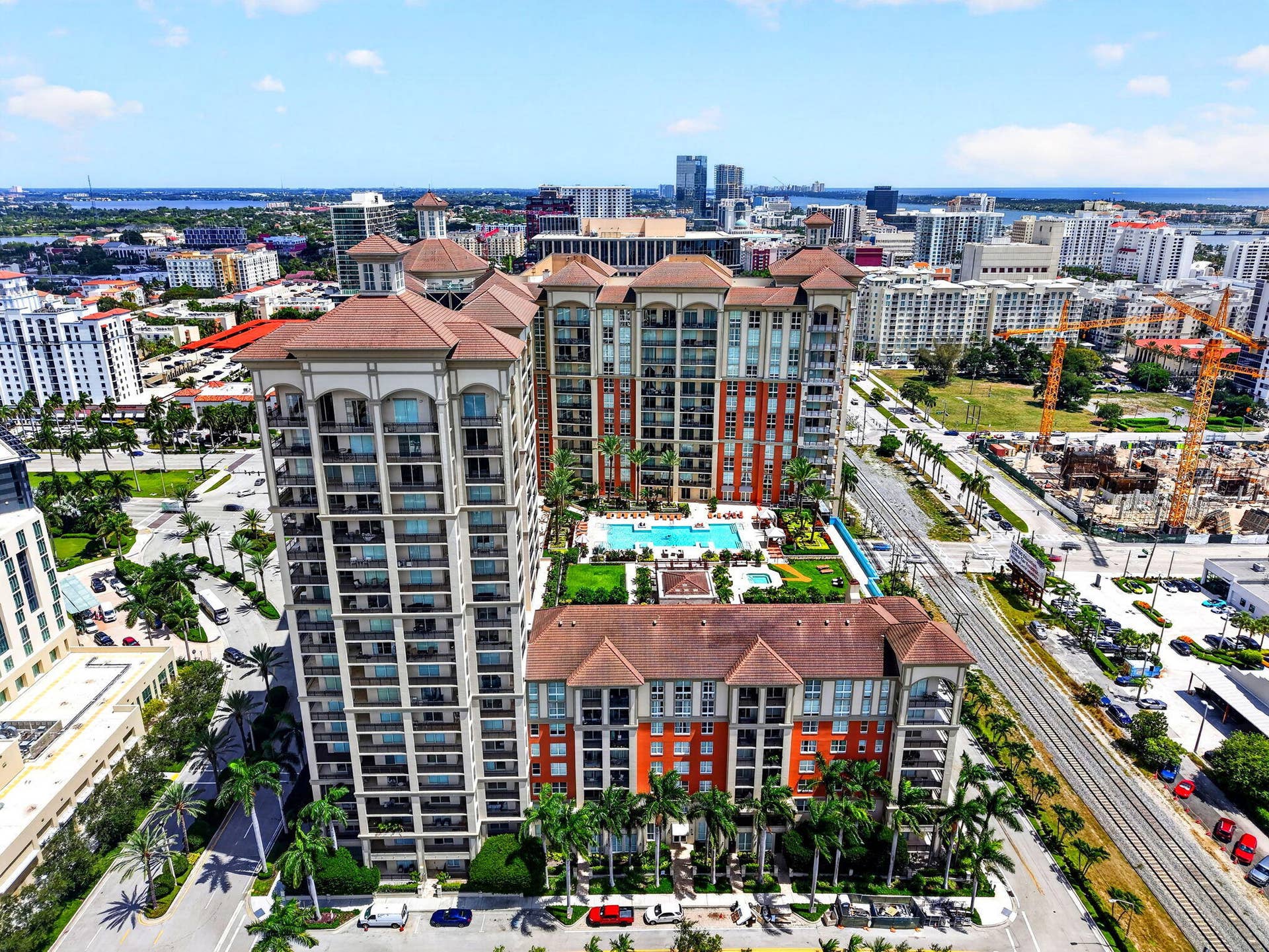 550 OKEECHOBEE Boulevard, #1618, West Palm Beach, West Palm Beach, FL 33401 Expansive high-rise building with multiple balconies, a rooftop pool, and surrounding urban landscape