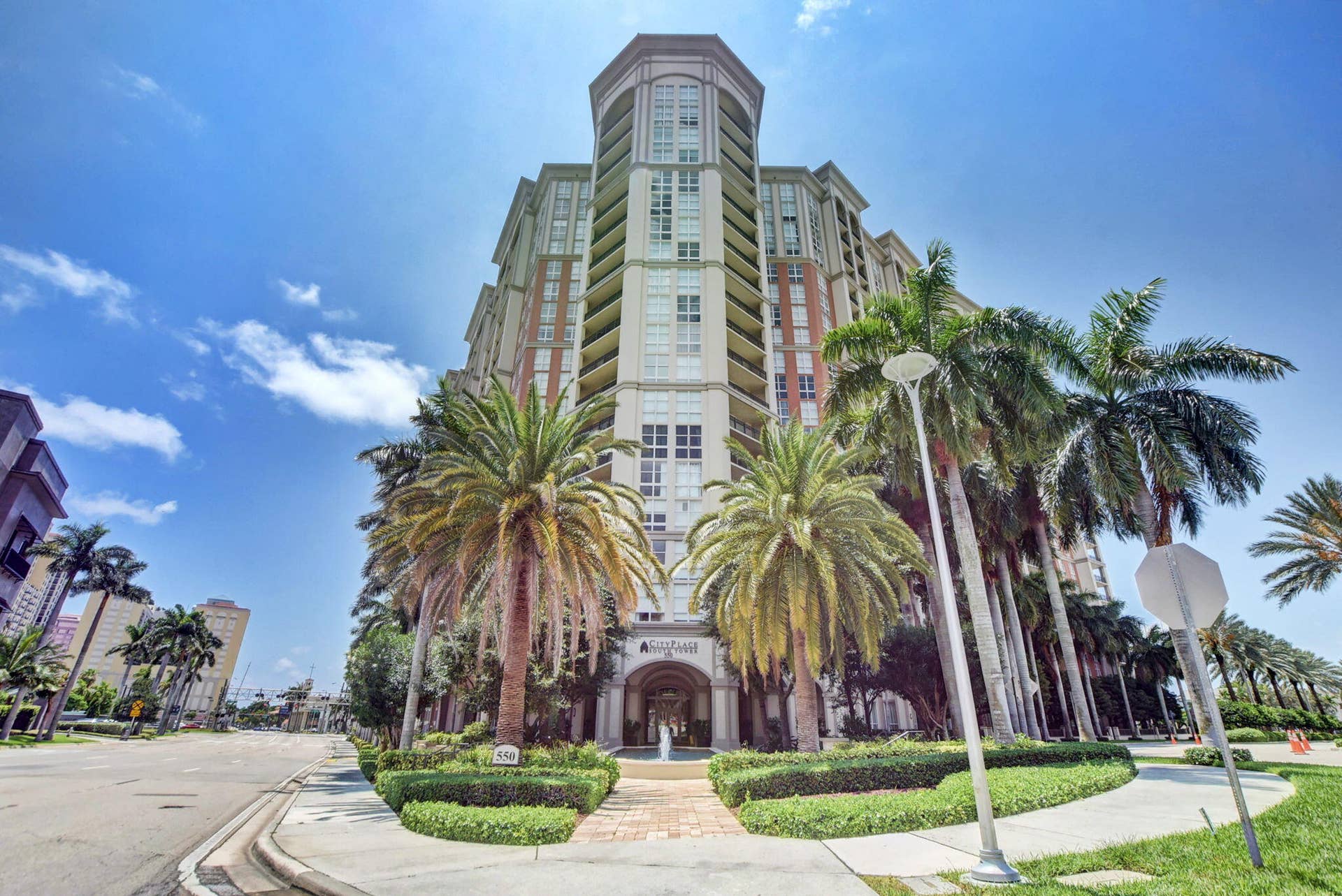 550 OKEECHOBEE Boulevard, #1618, West Palm Beach, West Palm Beach, FL 33401 Multi-story building featuring a prominent central tower with arched windows, multiple balconies, and a grand arched entrance