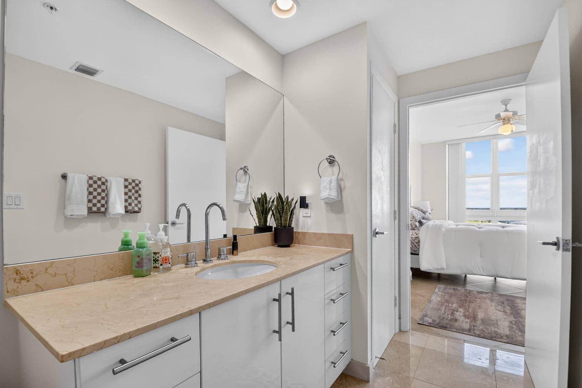 550 OKEECHOBEE Boulevard, #1618, West Palm Beach, West Palm Beach, FL 33401 Vanity with a polished stone countertop, undermount sink, and chrome fixtures