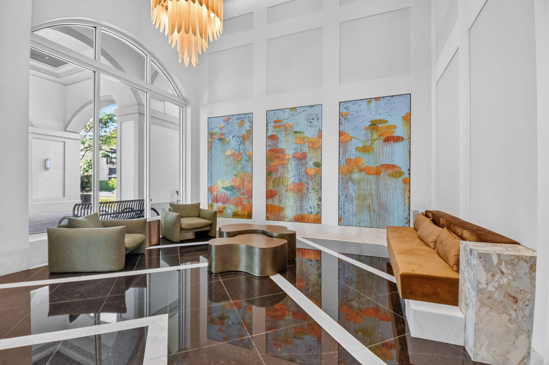 550 OKEECHOBEE Boulevard, #1618, West Palm Beach, West Palm Beach, FL 33401 Double-height ceiling, arched window, dark polished stone flooring with light-toned inlay, wall paneling, and a decorative chandelier