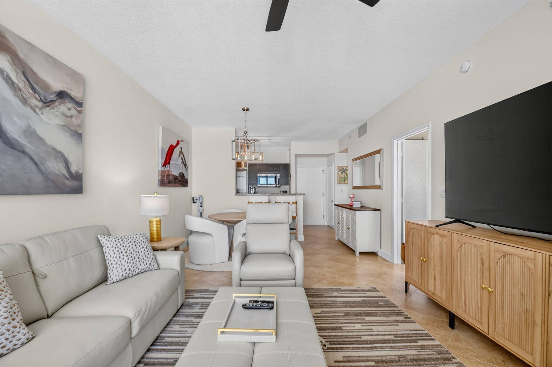 550 OKEECHOBEE Boulevard, #1618, West Palm Beach, West Palm Beach, FL 33401 Open-concept living area with light-toned walls, tile flooring, and a modern ceiling fan