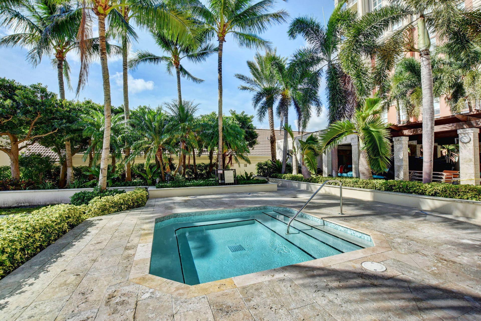 550 OKEECHOBEE Boulevard, #1618, West Palm Beach, West Palm Beach, FL 33401 Octagonal spa with integrated steps, surrounded by stone-finish paving and lush landscaping