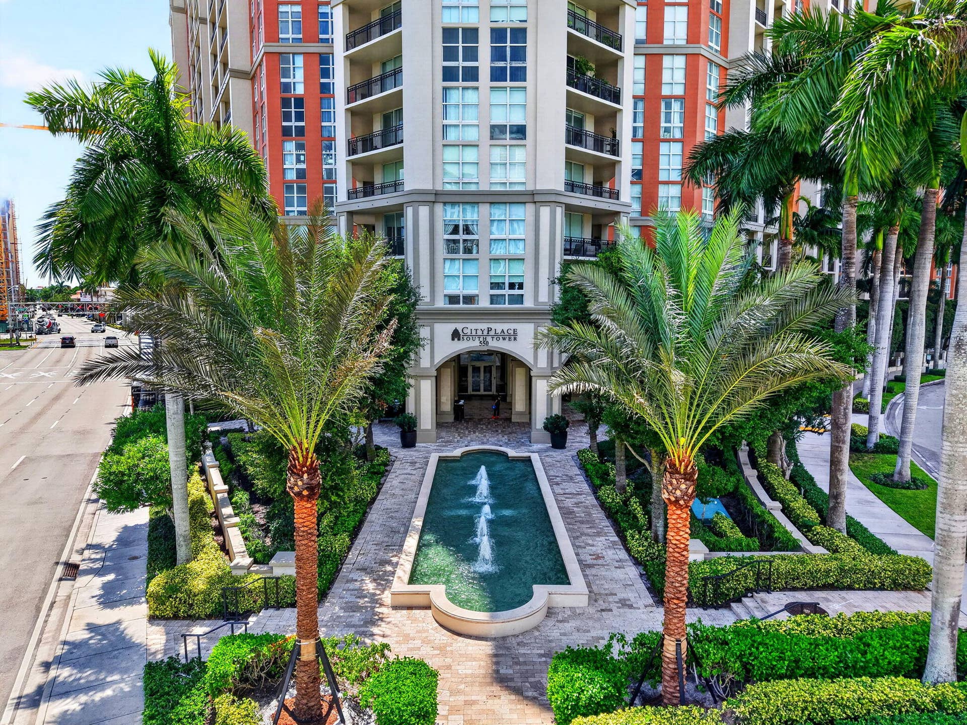 550 OKEECHOBEE Boulevard, #1618, West Palm Beach, West Palm Beach, FL 33401 High-rise architecture with multiple balconies, a structured entrance, and a formal water feature