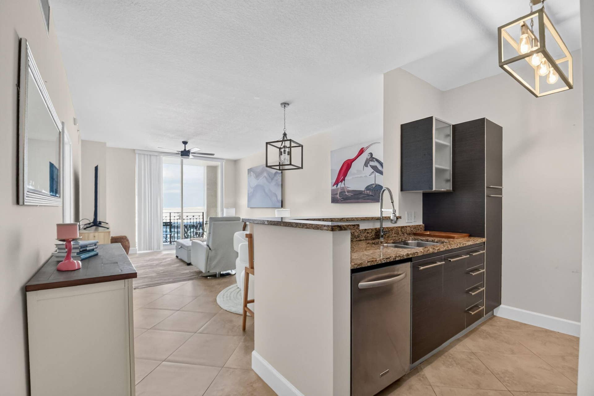 550 OKEECHOBEE Boulevard, #1618, West Palm Beach, West Palm Beach, FL 33401 Compact kitchen with granite-finish countertops, stainless-steel appliances, and dark wood-finish cabinetry