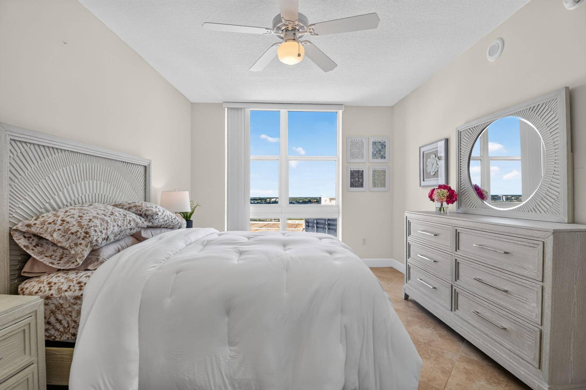 550 OKEECHOBEE Boulevard, #1618, West Palm Beach, West Palm Beach, FL 33401 Full-height window, ceiling fan with integrated lighting, tile flooring, and a decorative headboard