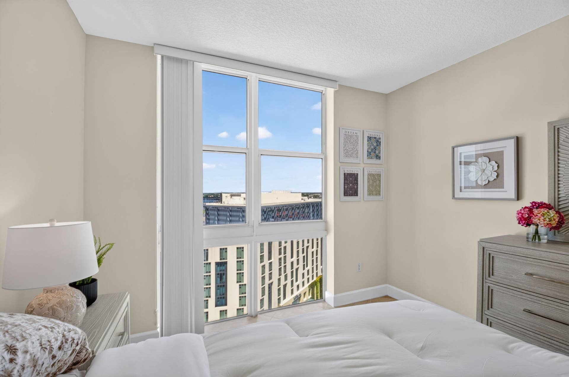 550 OKEECHOBEE Boulevard, #1618, West Palm Beach, West Palm Beach, FL 33401 Floor-to-ceiling windows, light neutral wall color, wood-finish flooring, white window treatments, and white trim