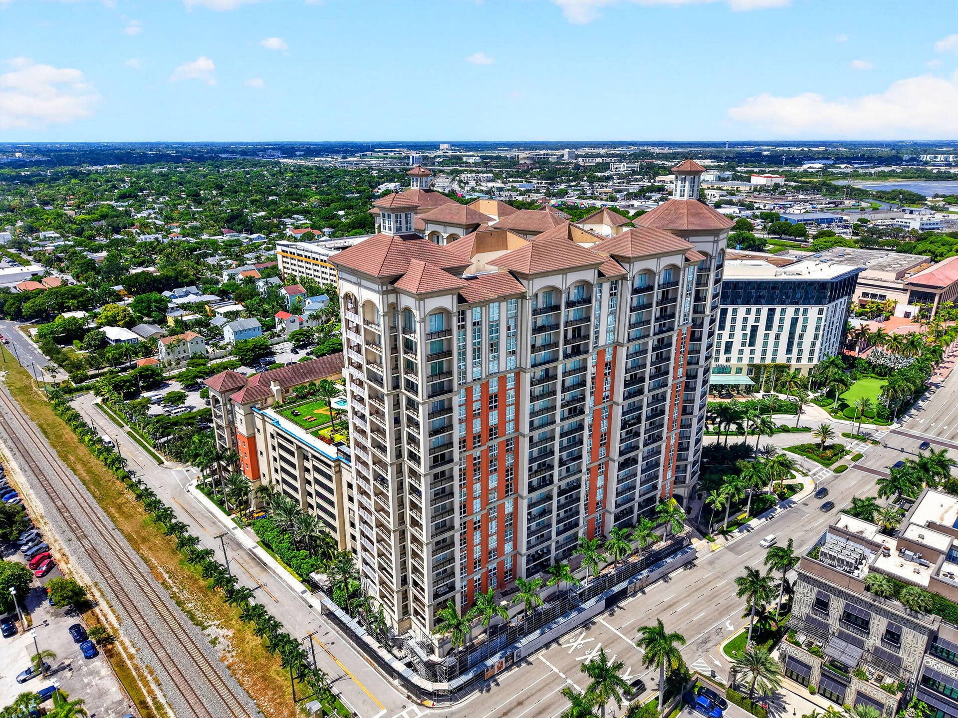 550 OKEECHOBEE Boulevard, #1618, West Palm Beach, West Palm Beach, FL 33401 High-rise building with extensive balconies, multi-story facade, and a rooftop green space