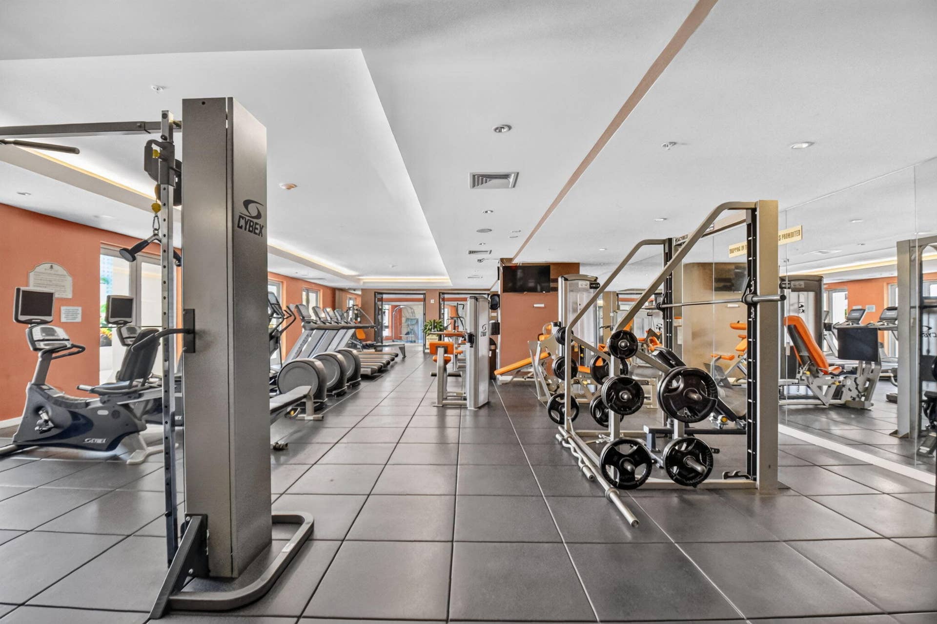 550 OKEECHOBEE Boulevard, #1618, West Palm Beach, West Palm Beach, FL 33401 Fitness center featuring extensive exercise equipment, mirrored wall accents, a drop ceiling with recessed lighting, and durable floor tiling