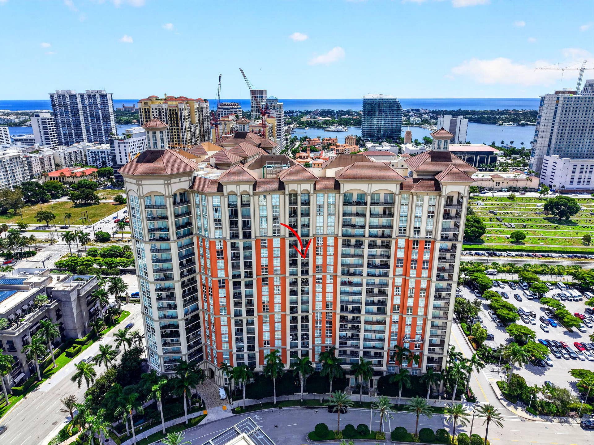 550 OKEECHOBEE Boulevard, #1618, West Palm Beach, West Palm Beach, FL 33401 Multi-story building featuring terracotta-colored roof tiles, arched windows, and individual balconies