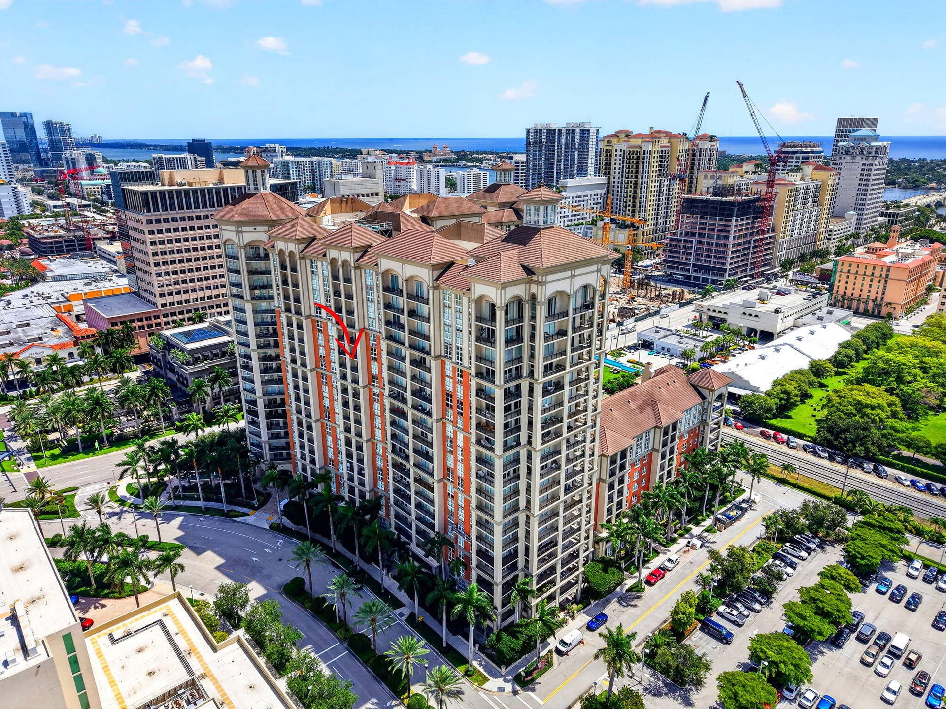 550 OKEECHOBEE Boulevard, #1618, West Palm Beach, West Palm Beach, FL 33401 High-rise building with multiple balconies, a structured parking area, and surrounding urban landscape