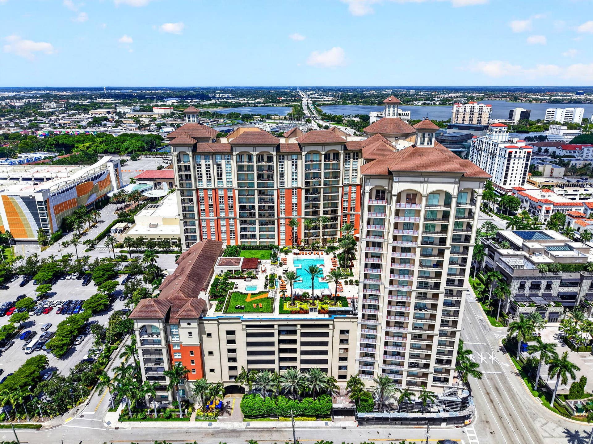 550 OKEECHOBEE Boulevard, #1618, West Palm Beach, West Palm Beach, FL 33401 Multi-story residential buildings with terra cotta tile roofs, multiple balconies, and a central pool area