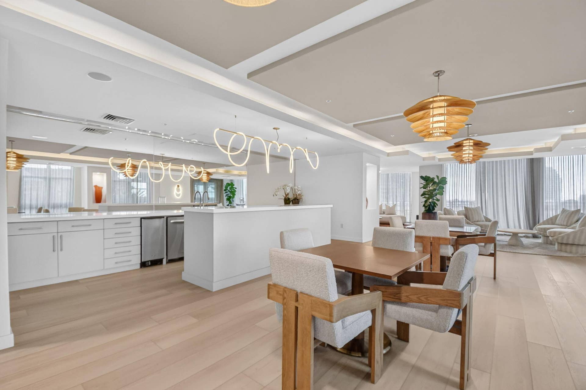 550 OKEECHOBEE Boulevard, #1618, West Palm Beach, West Palm Beach, FL 33401 Light wood-finish flooring, recessed ceiling lighting, kitchen area with white cabinetry, stainless steel appliances, and a central island