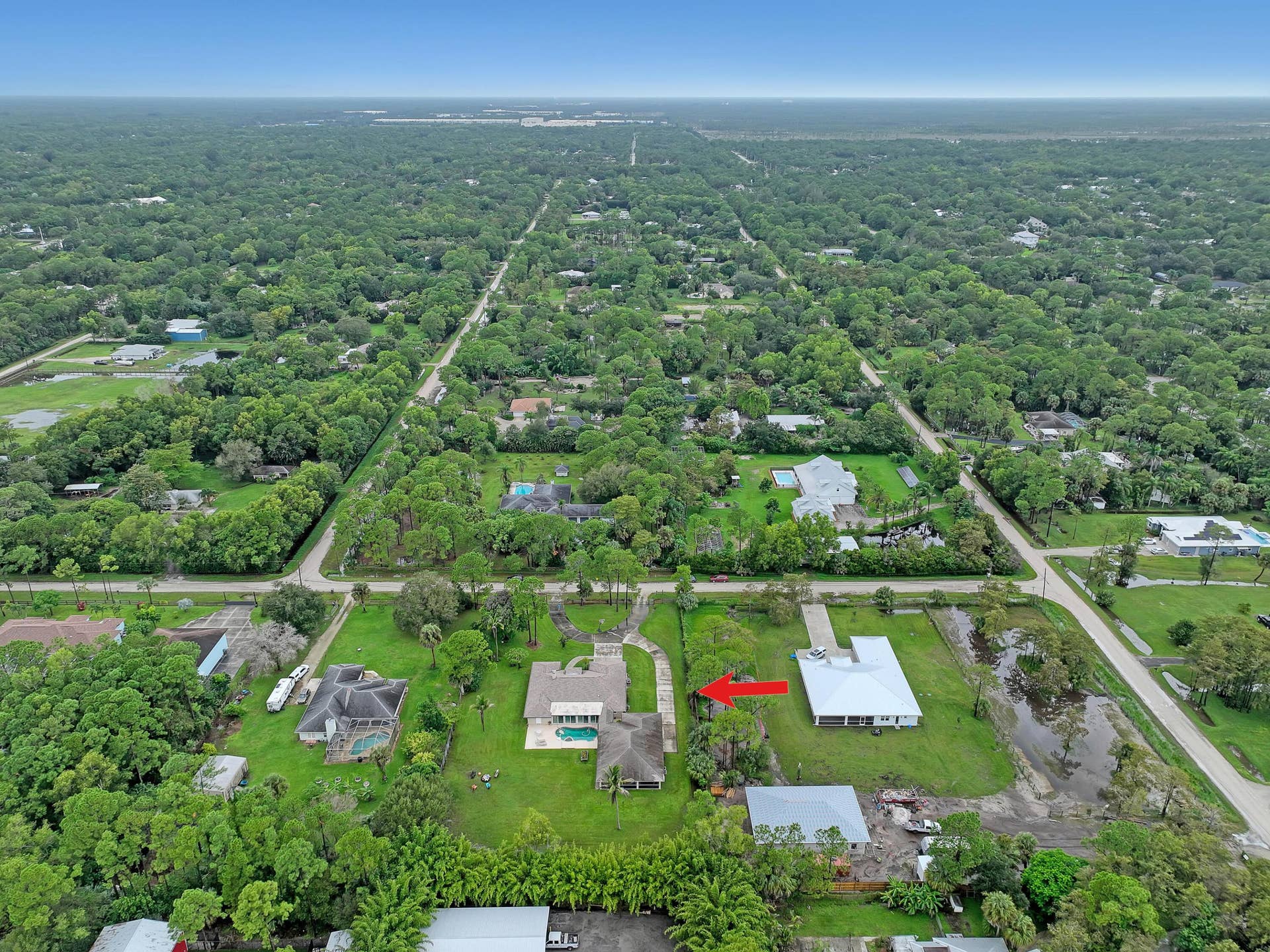 15862 121ST Terrace N, Jupiter, FL 33478 aerial east to west arrow15862 121st Ter
