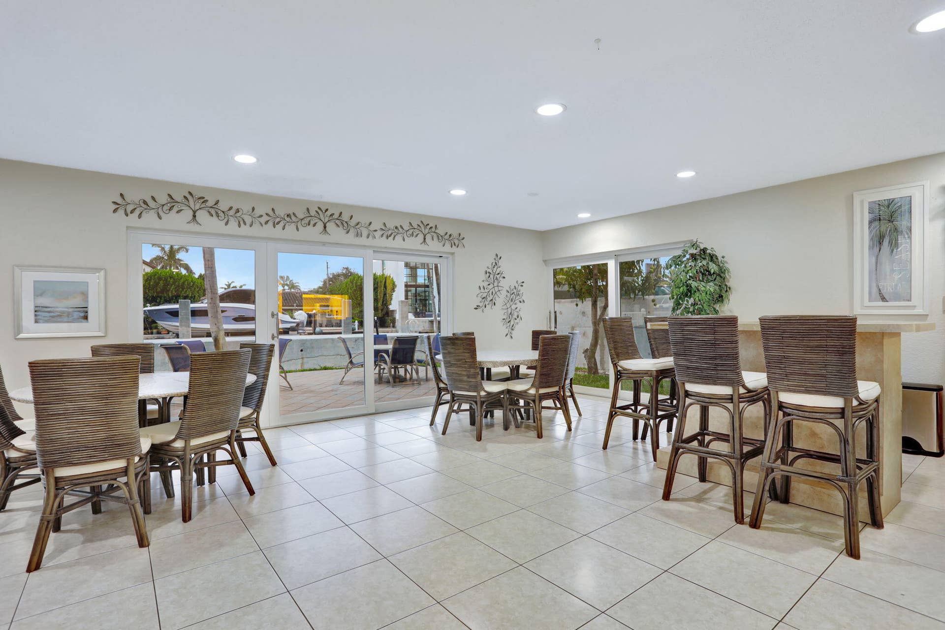Rec center off pool with indoor/outdoor seating, kitchen, grill, bathrooms