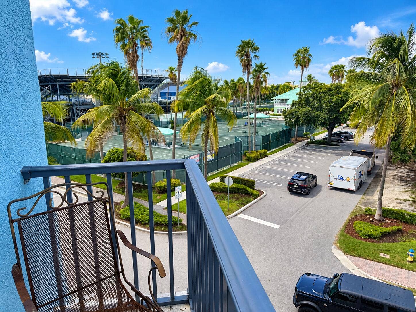 Sunny Tropical Balcony Overlooking Tenni