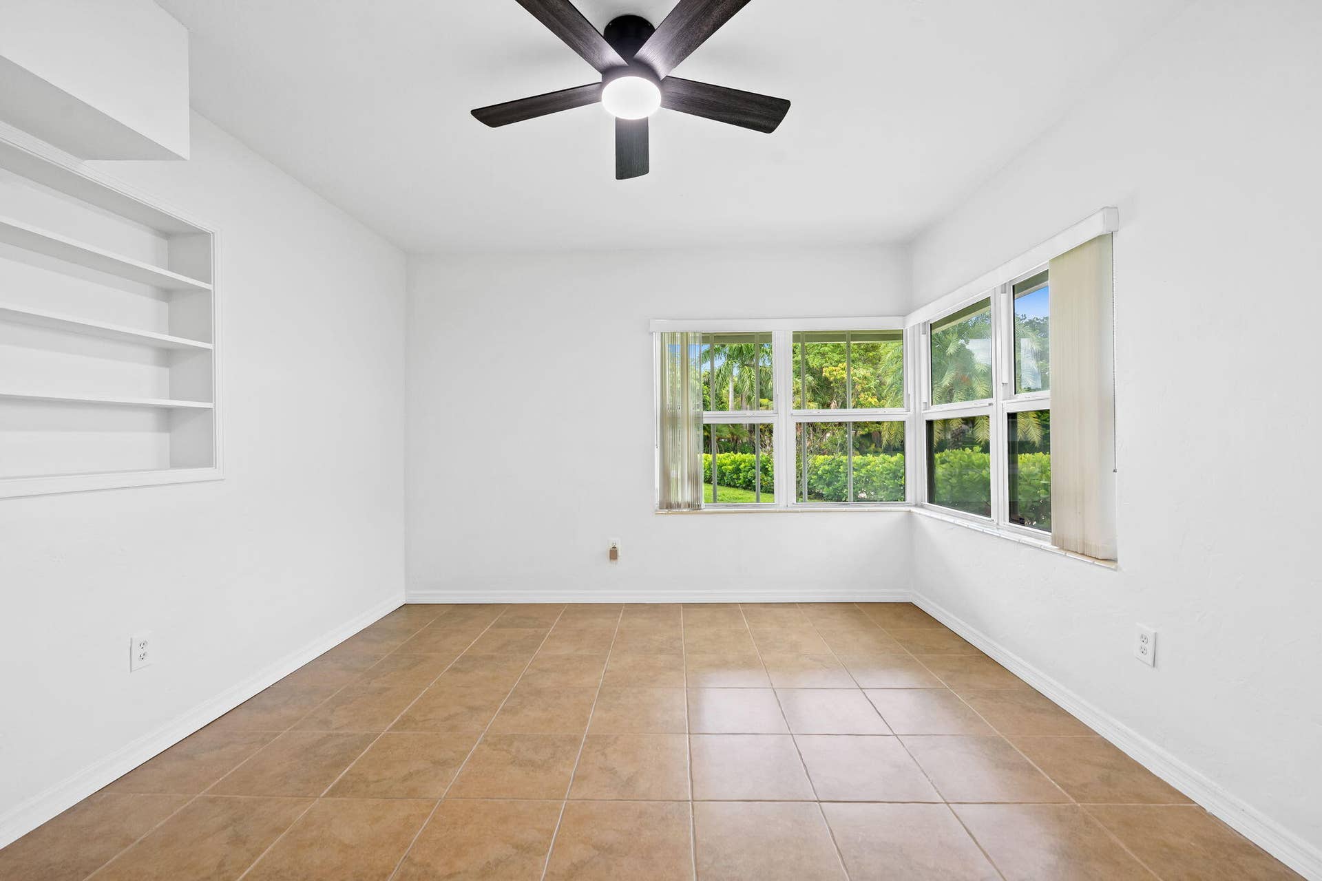 1705 NE 26TH Avenue, Fort Lauderdale, FL 33305 Recessed built-in shelving, ceiling fan with integrated lighting, and tile flooring