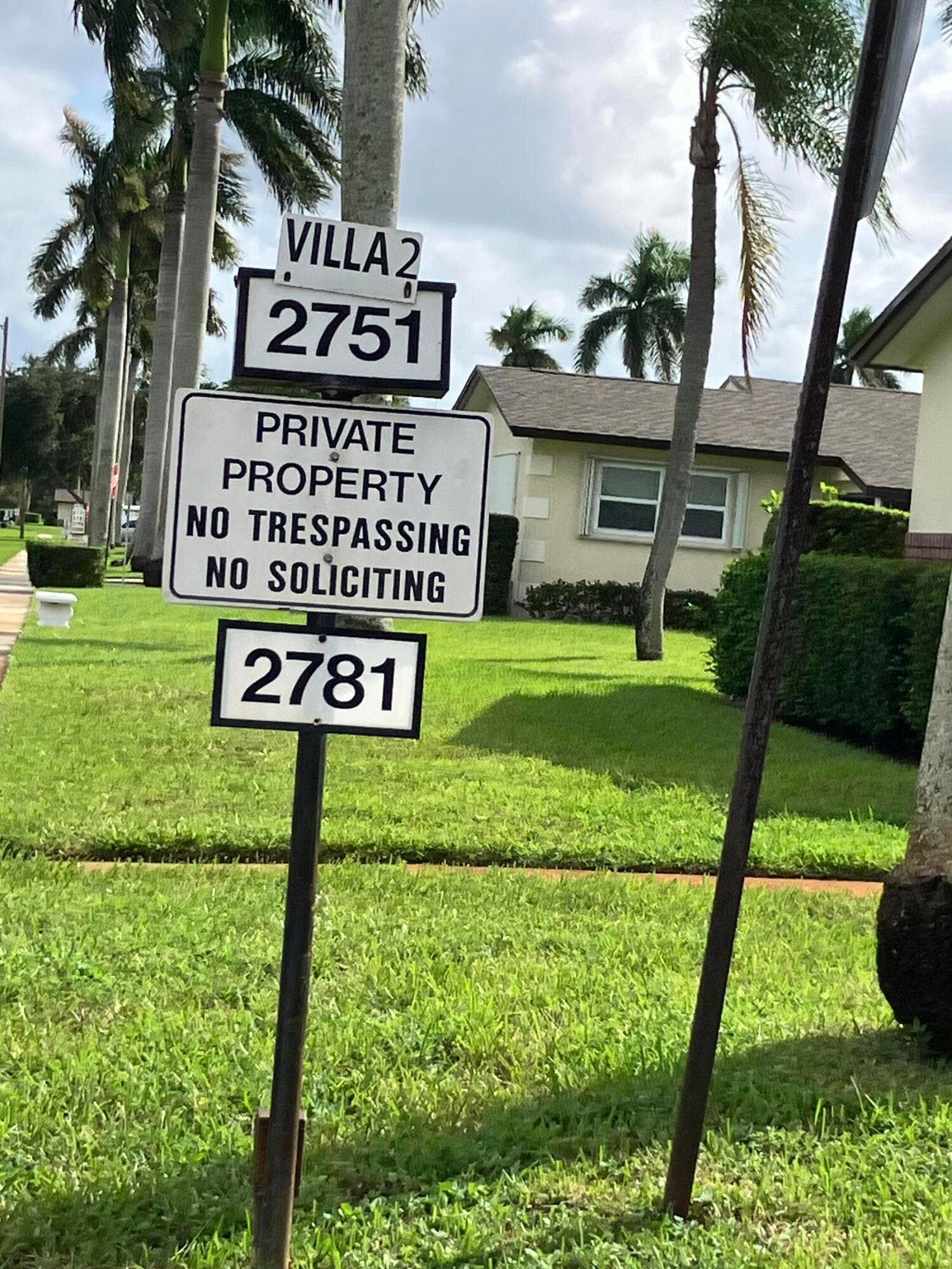 Sign showing entrance to villa 2 where the condo is located