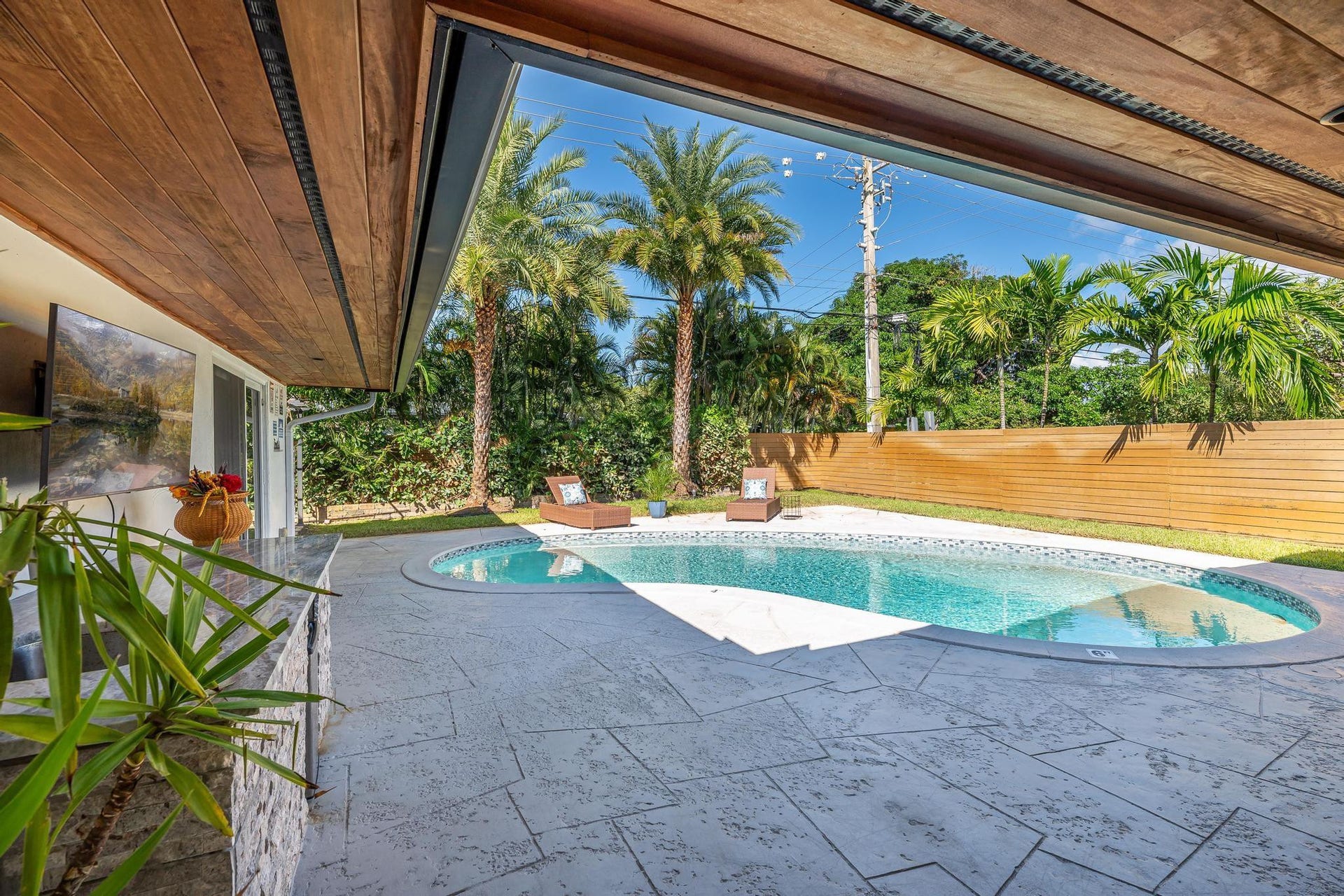 Covered patio overlooking the pool