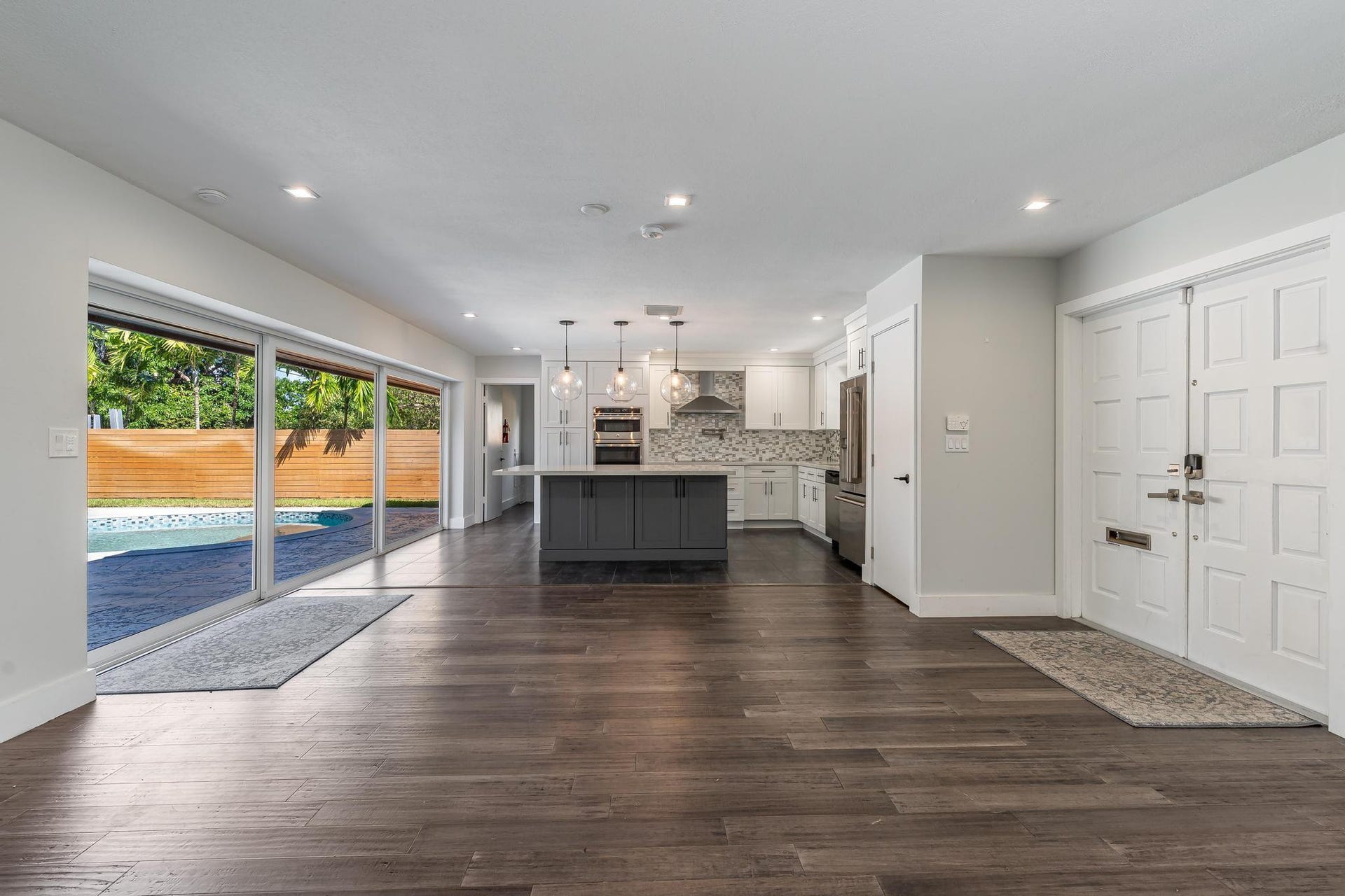 Open floor plan with sliding glass doors
