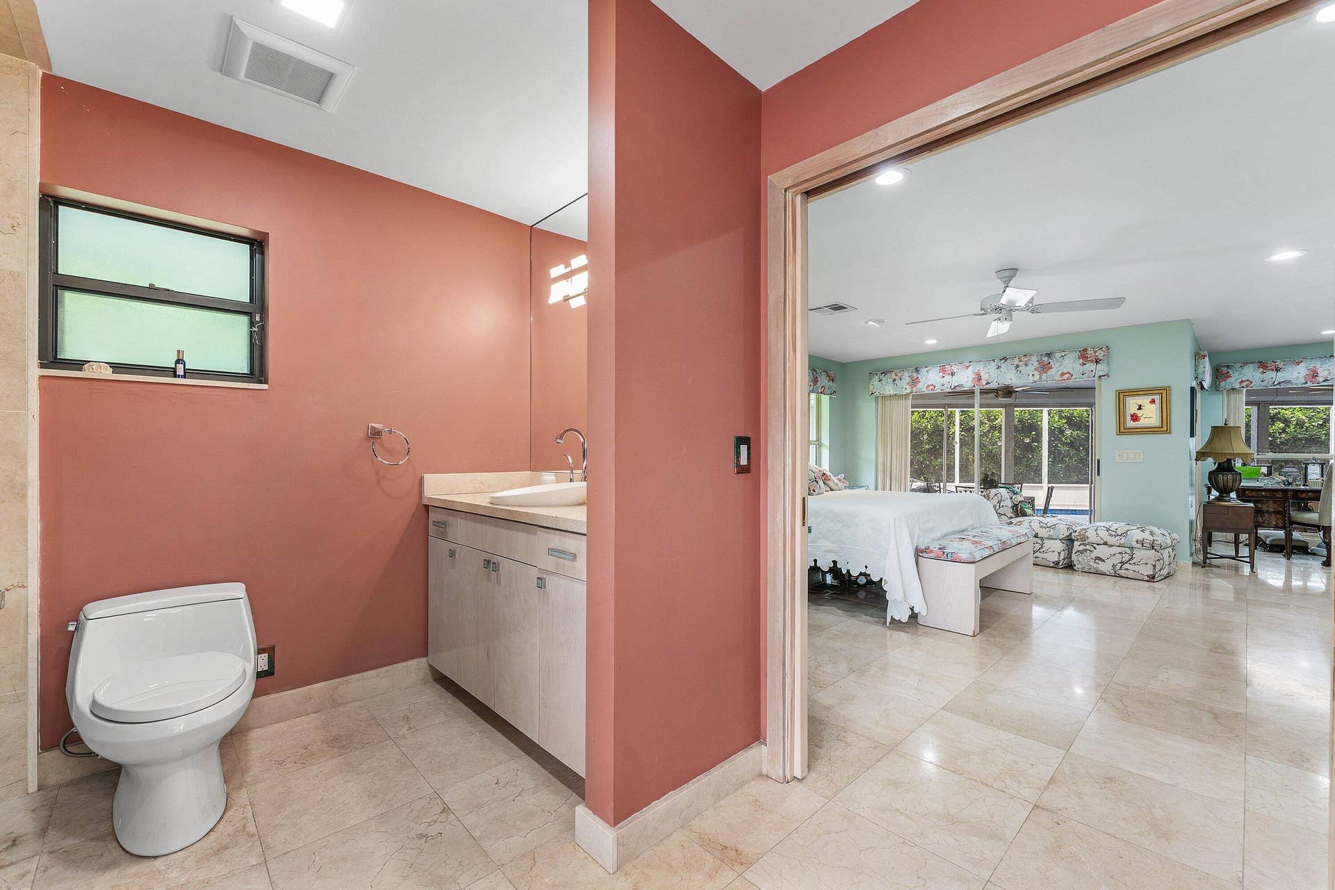 56 NORTHWOODS Lane, Boynton Beach, FL 33436 Bathroom with a vanity, integrated sink, and an expansive mirror