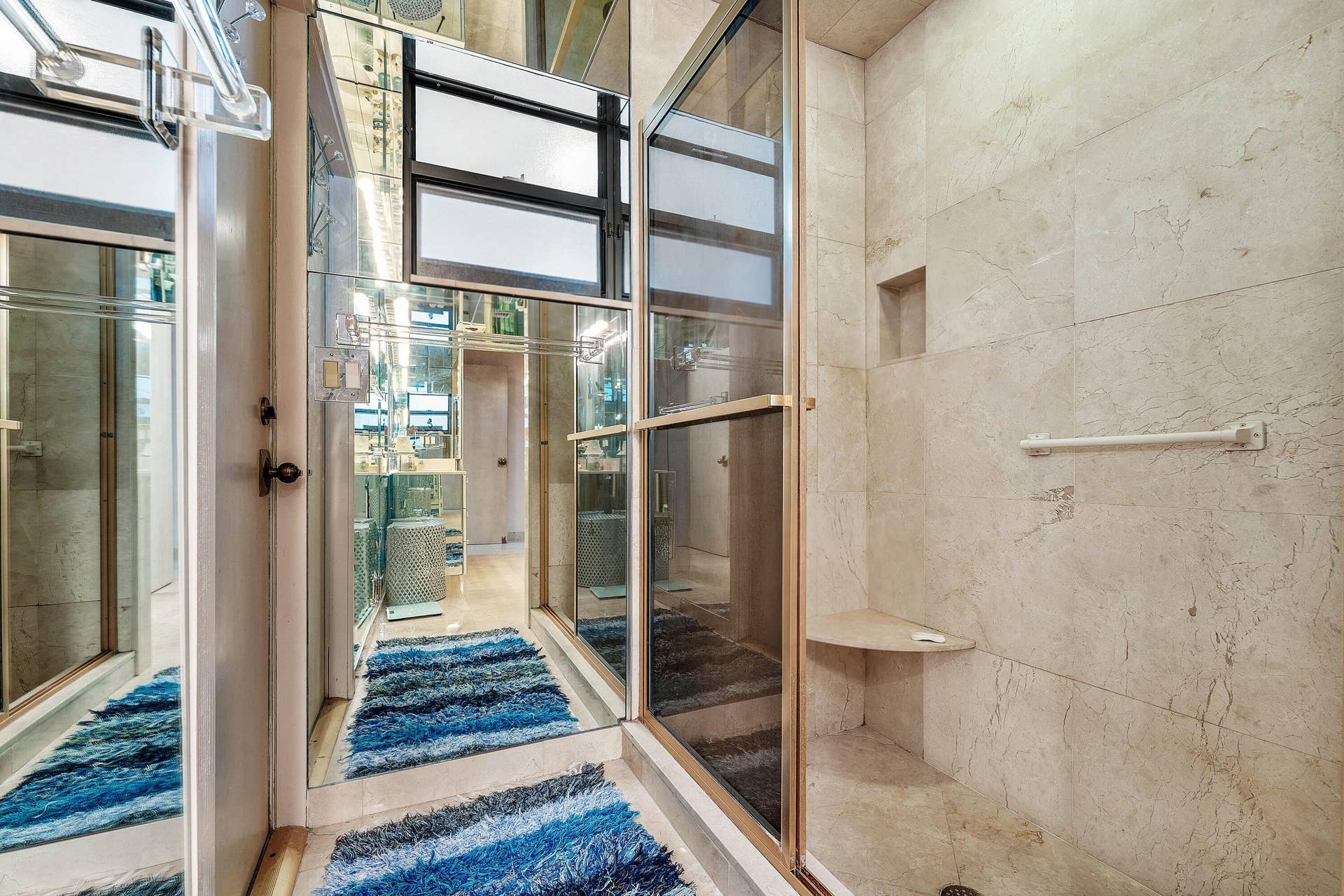 56 NORTHWOODS Lane, Boynton Beach, FL 33436 Shower enclosure with a built-in corner bench and recessed storage niche