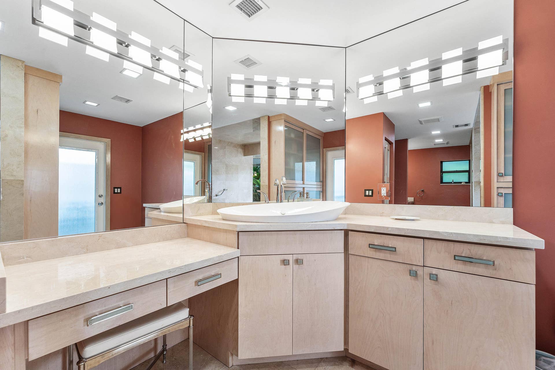 56 NORTHWOODS Lane, Boynton Beach, FL 33436 Dual vanity with light wood-finish cabinetry, integrated vessel sink, and an expansive countertop