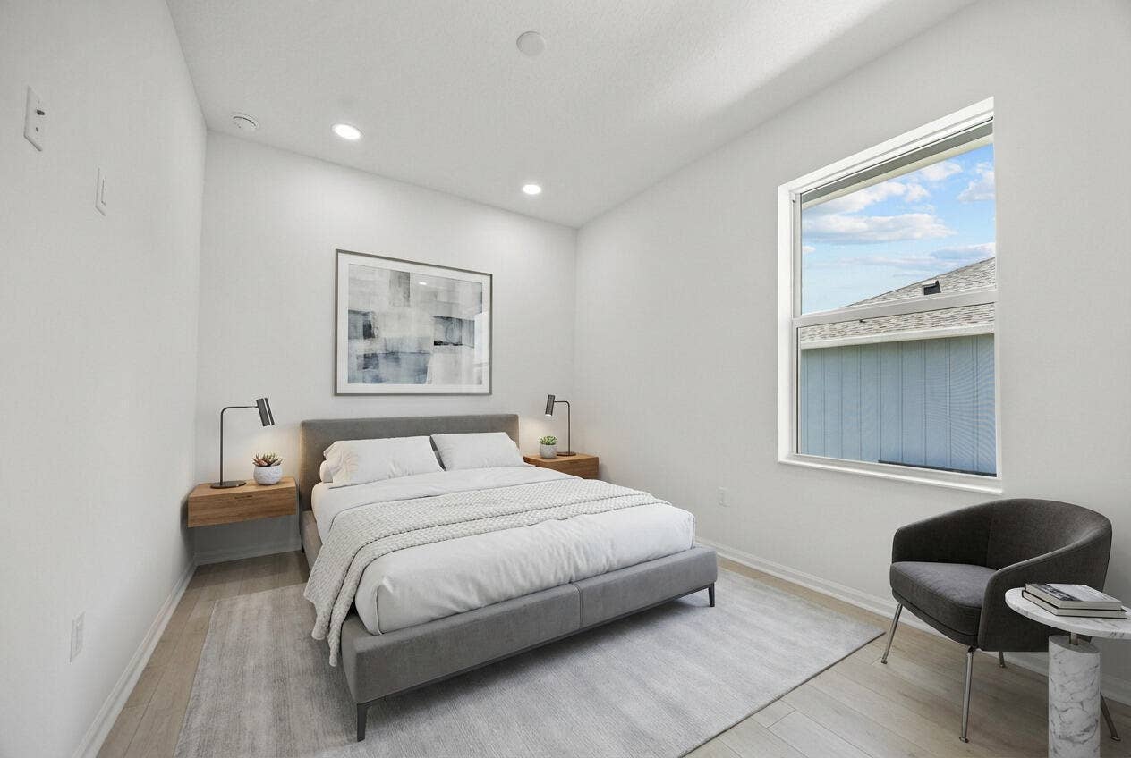 Recessed ceiling lighting, wood-finish flooring, and a large window