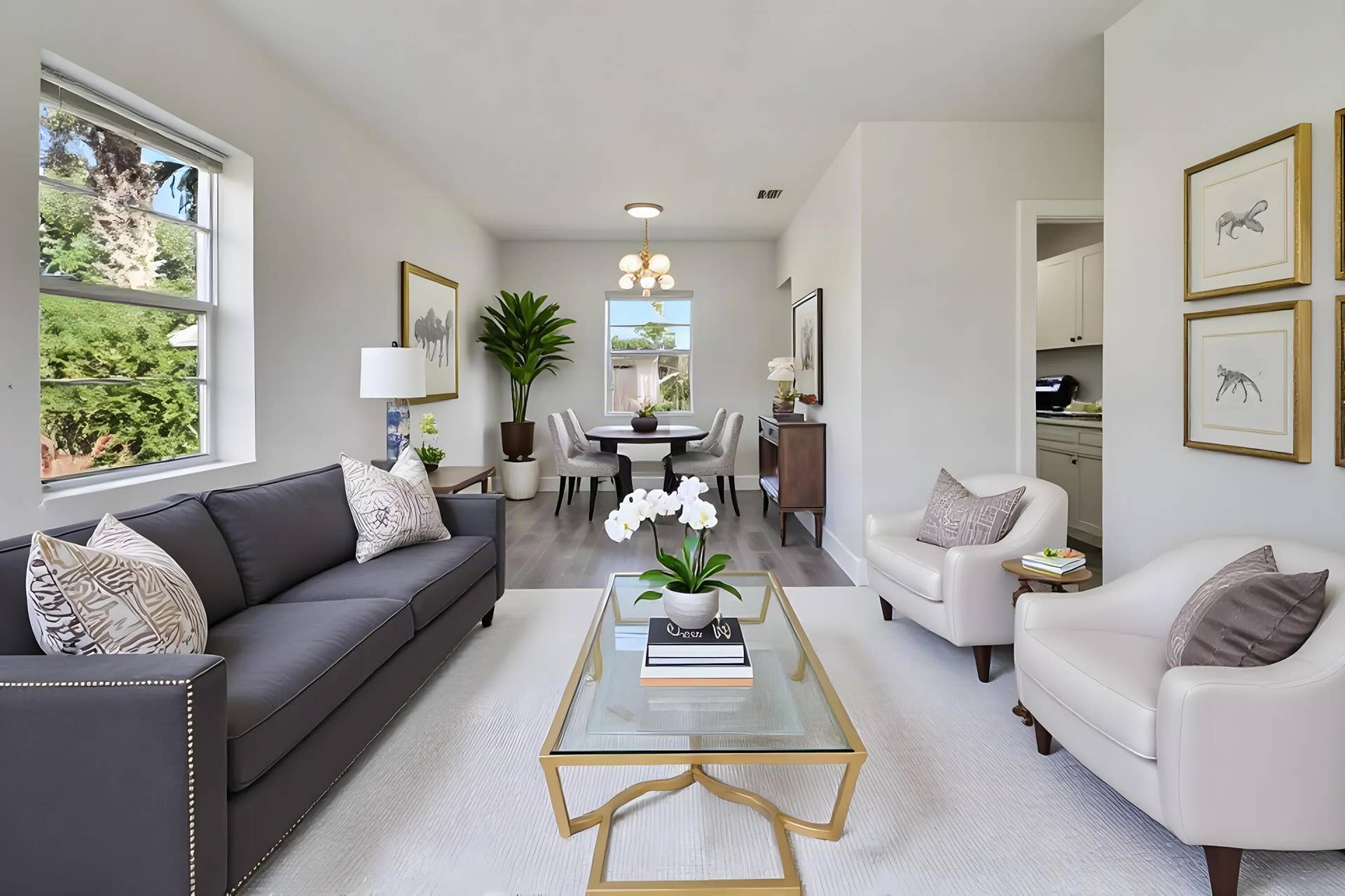 Open-concept living area with light gray walls, wood-finish flooring, and recessed lighting