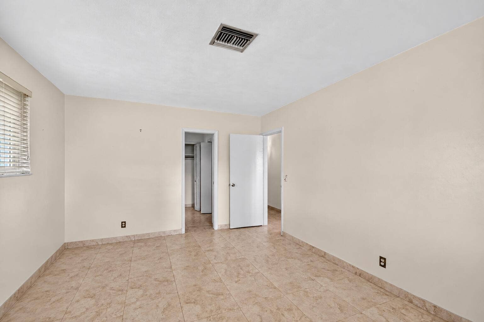 Empty Neutral Room with Open Doors