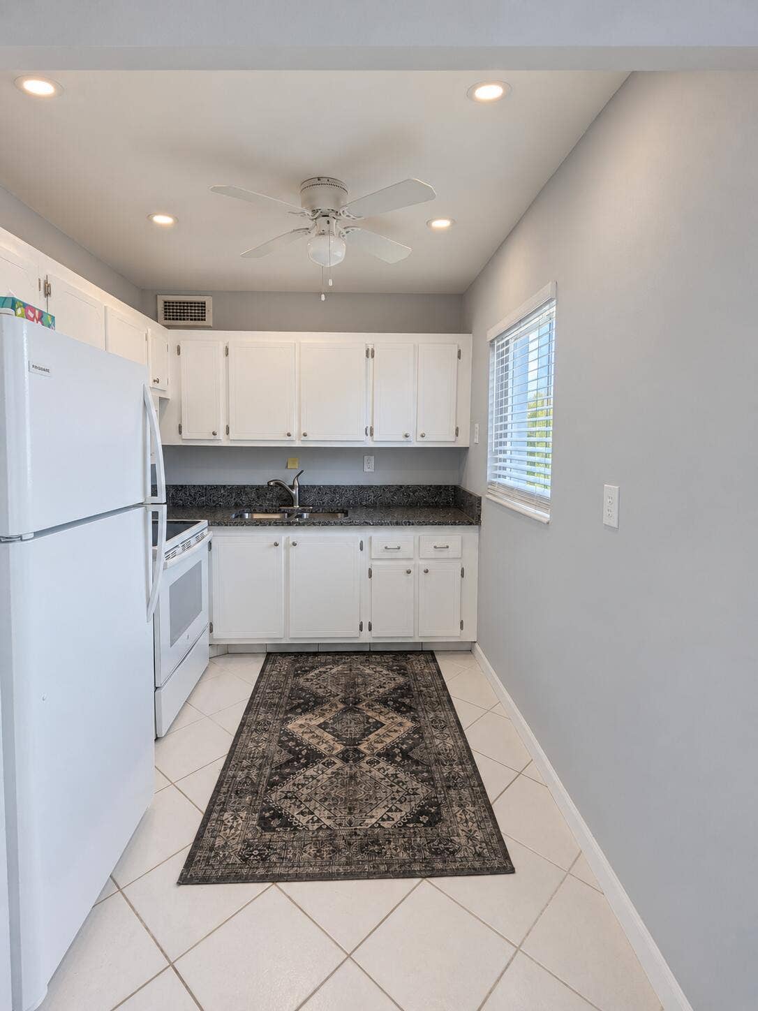 Updated Kitchen w Granite Counters and Recessed Lighting