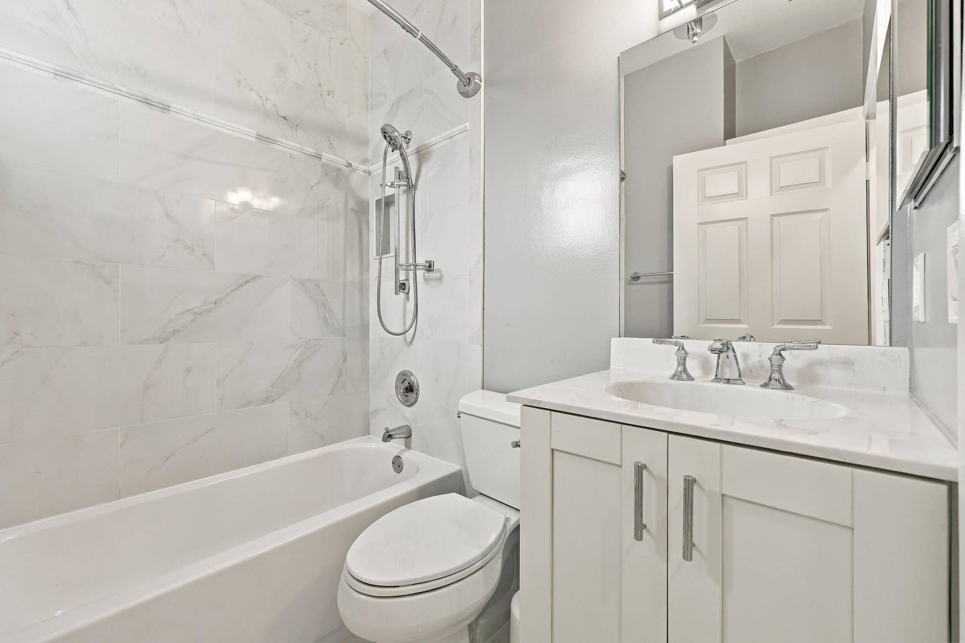 8292 WATERLINE Drive, #106, Boynton Beach, FL 33472 White vanity with brushed nickel hardware, undermount sink, and light-toned countertop